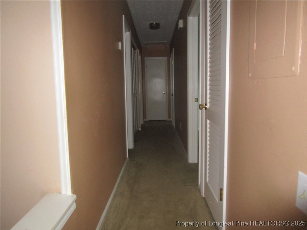 821 Rock Spring Road Fayetteville, NC 28314 - Photo 5 of 23 a view of a hallway with wooden floor