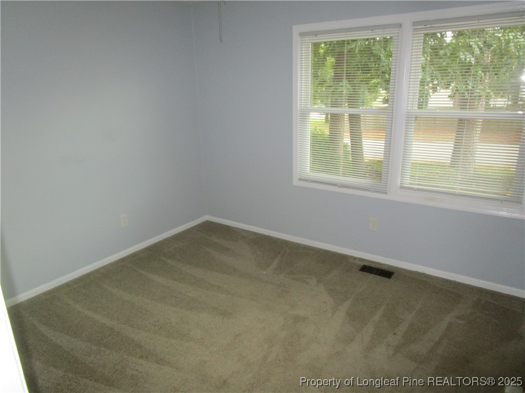821 Rock Spring Road Fayetteville, NC 28314 - Photo 6 of 23 an empty room with a window