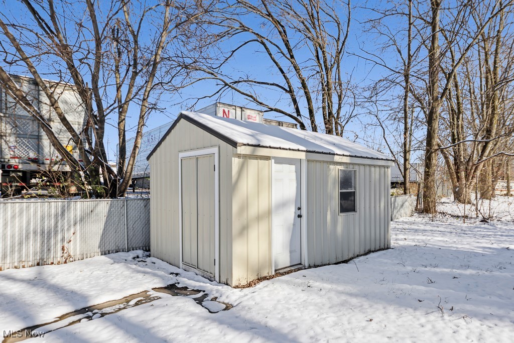 4722 Navarre Road Southwest Canton, OH 44706 - Photo 35 of 38 Snow covered structure featuring a storage shed