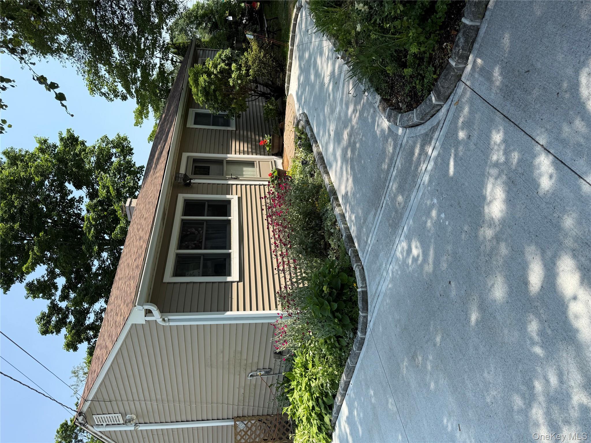 View of front of property with roof with shingles