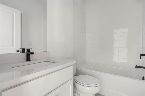 a view of room with window and ceiling fan