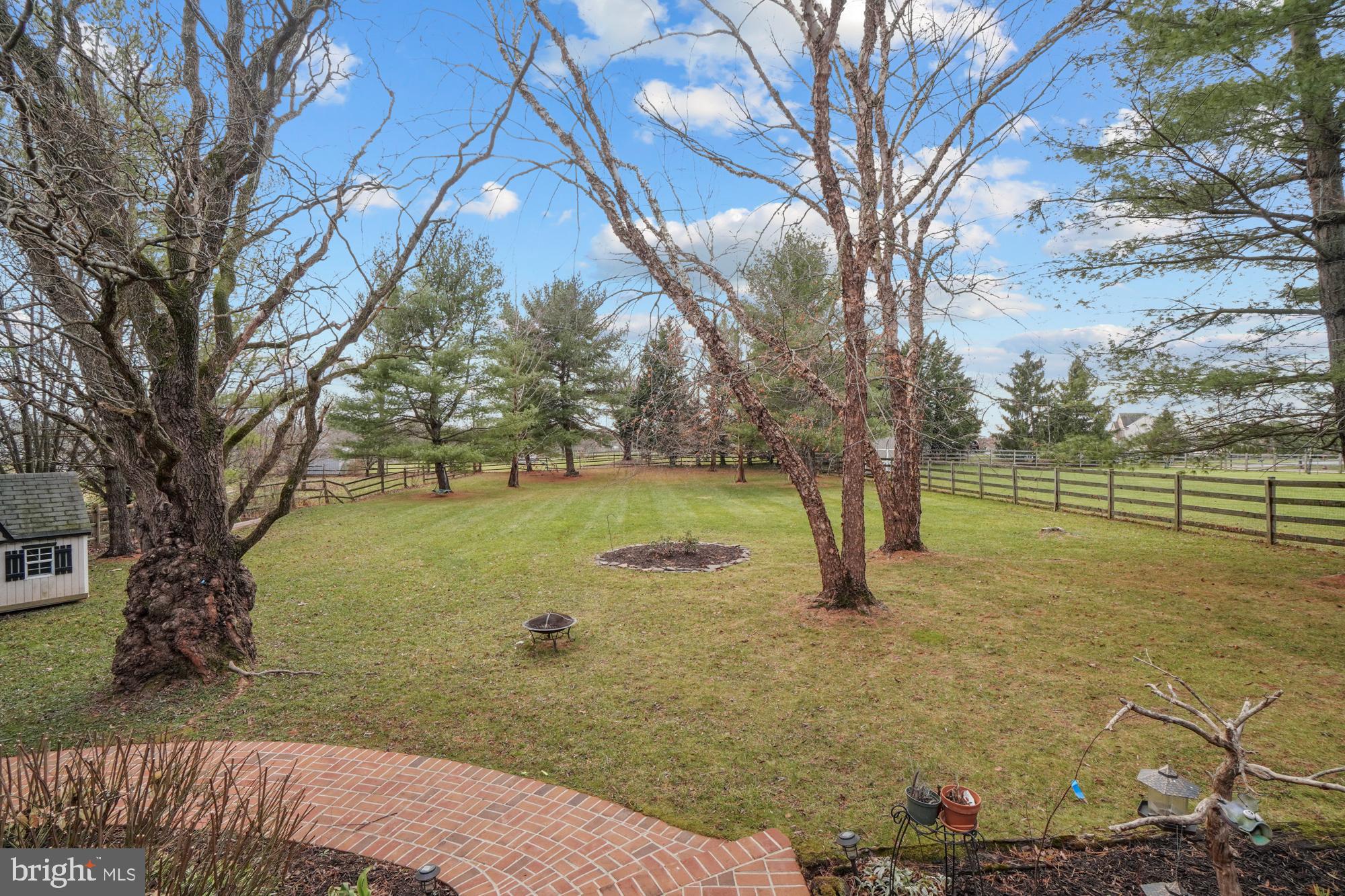 16908 Hoskinson Road Poolesville, MD 20837 - Photo 12 of 72 a backyard of a house with lots of green space