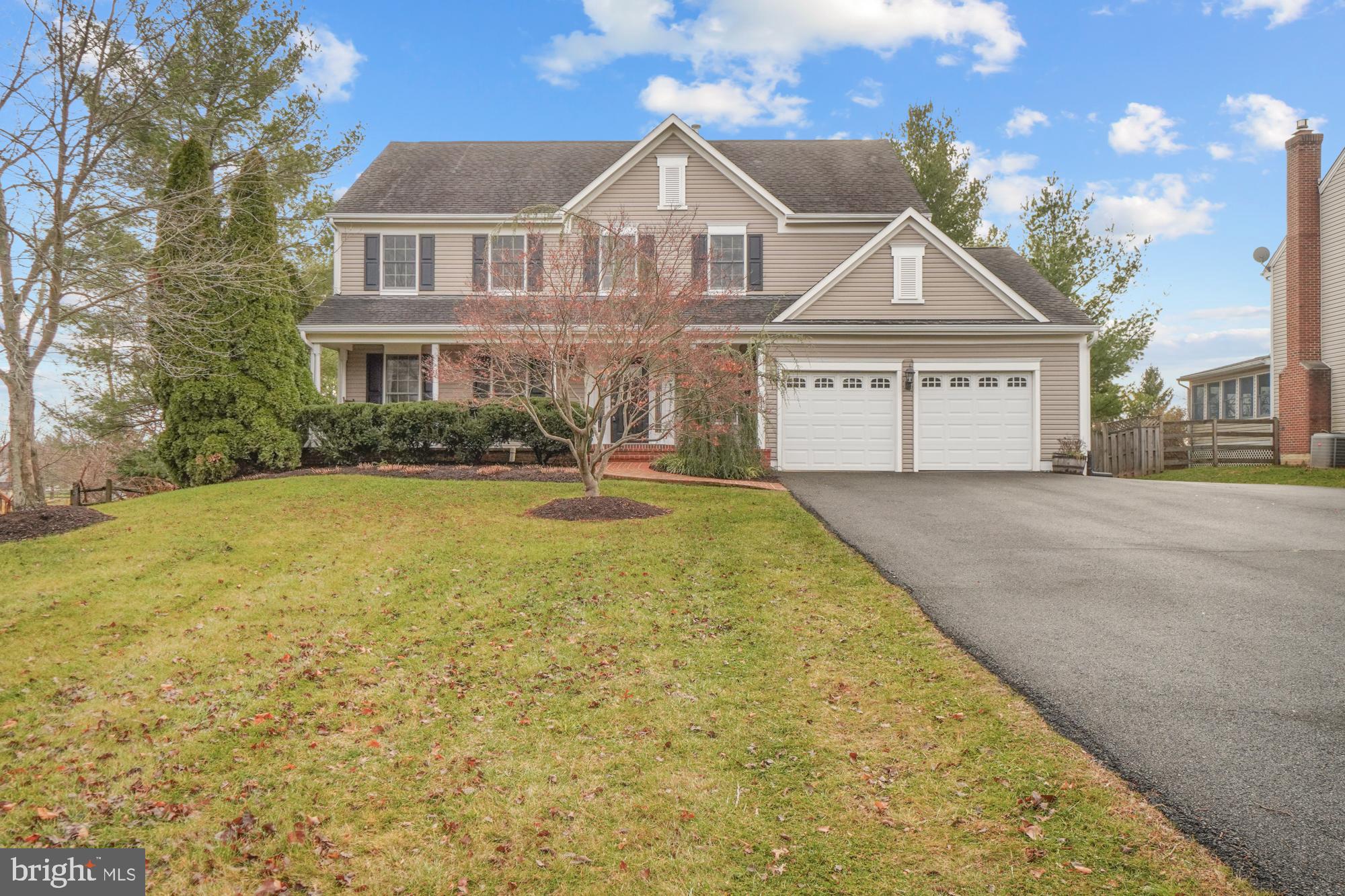 16908 Hoskinson Road Poolesville, MD 20837 - Photo 2 of 72 a front view of a house with a yard