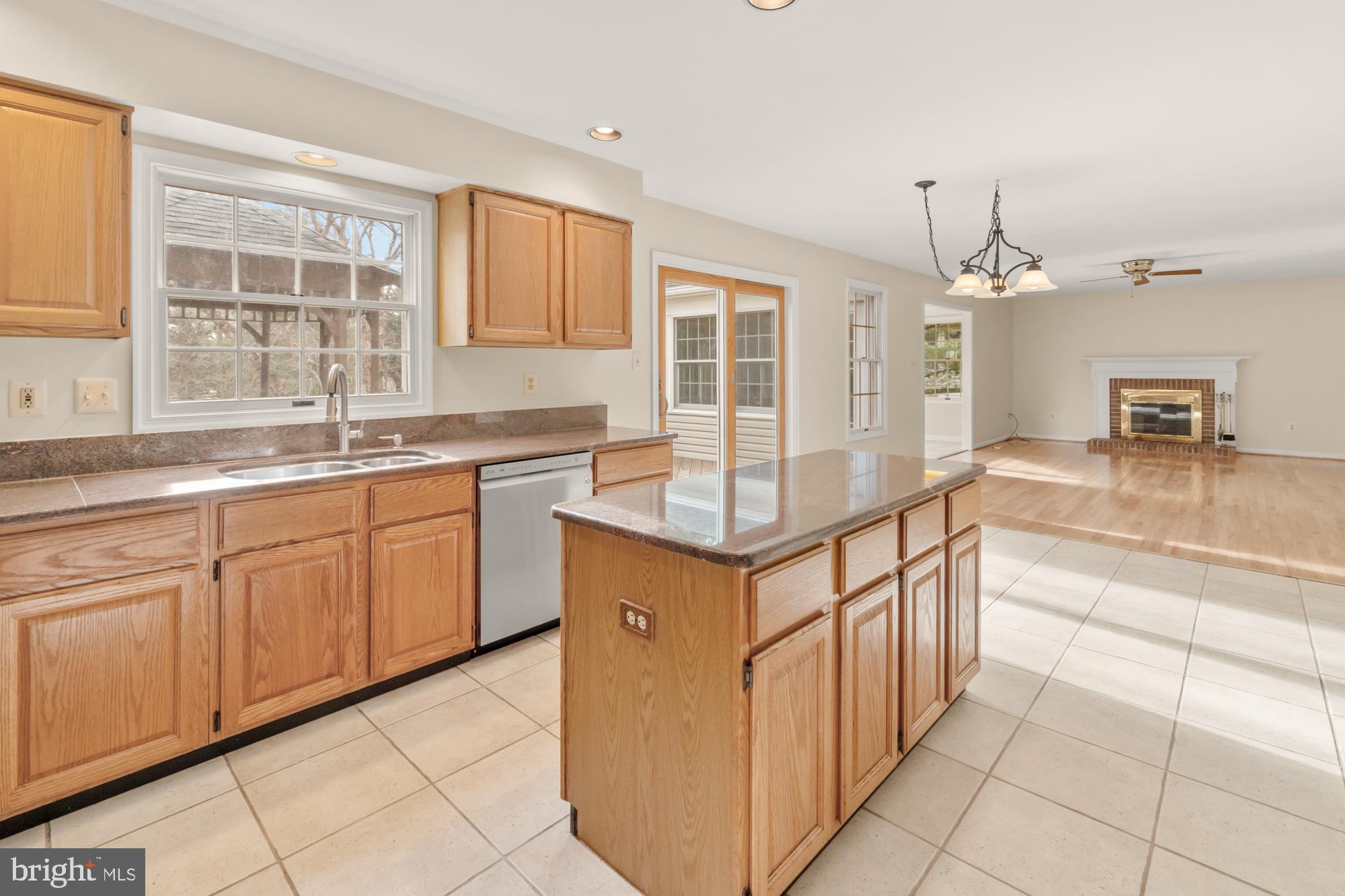 16908 Hoskinson Road Poolesville, MD 20837 - Photo 25 of 72 a kitchen with kitchen island granite countertop a sink counter top space and cabinets