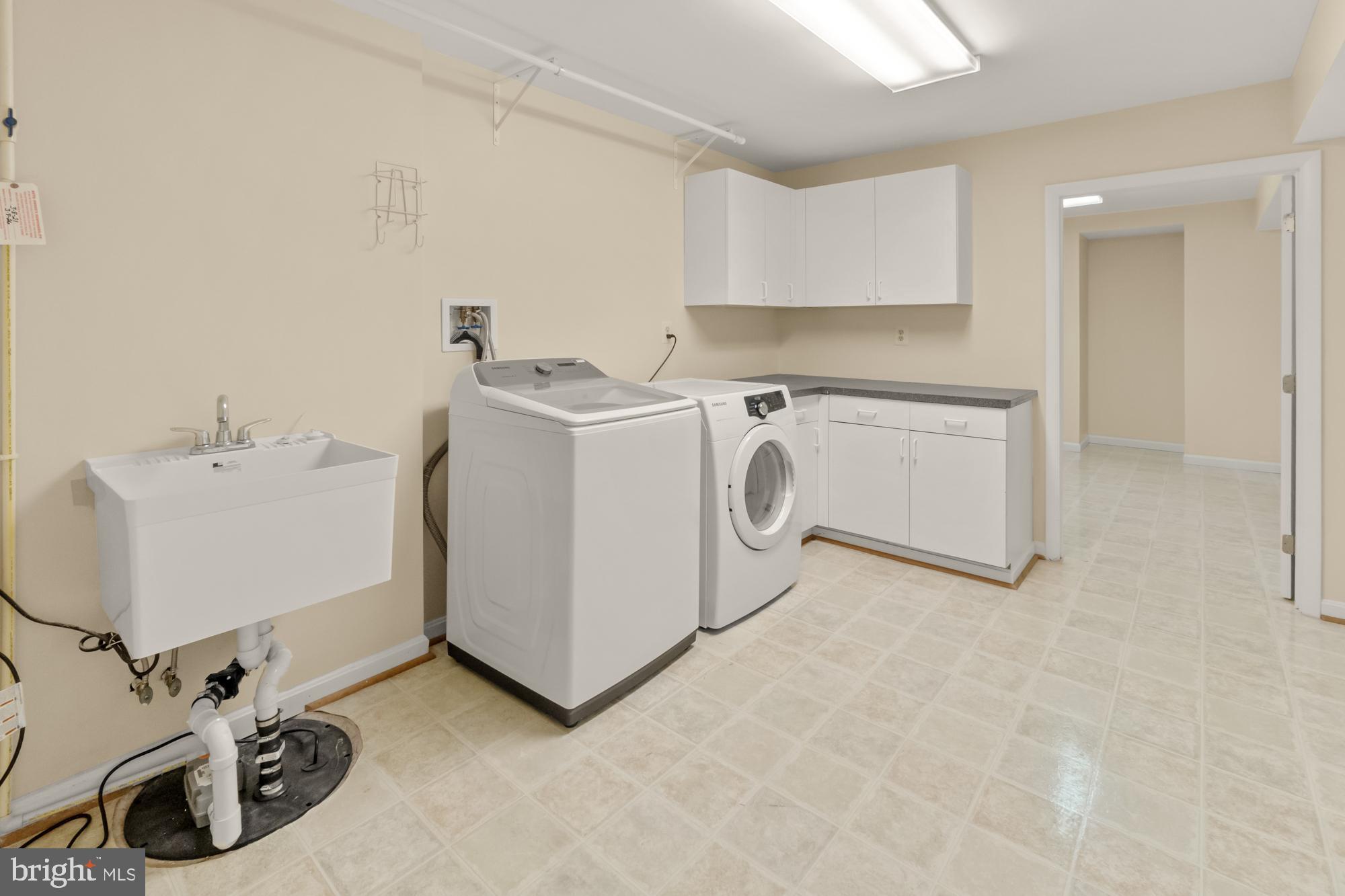 16908 Hoskinson Road Poolesville, MD 20837 - Photo 54 of 72 a utility room with dryer and washer