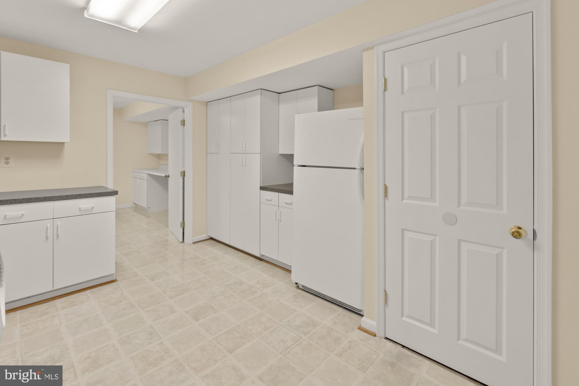 16908 Hoskinson Road Poolesville, MD 20837 - Photo 55 of 72 a view of a kitchen with white cabinets