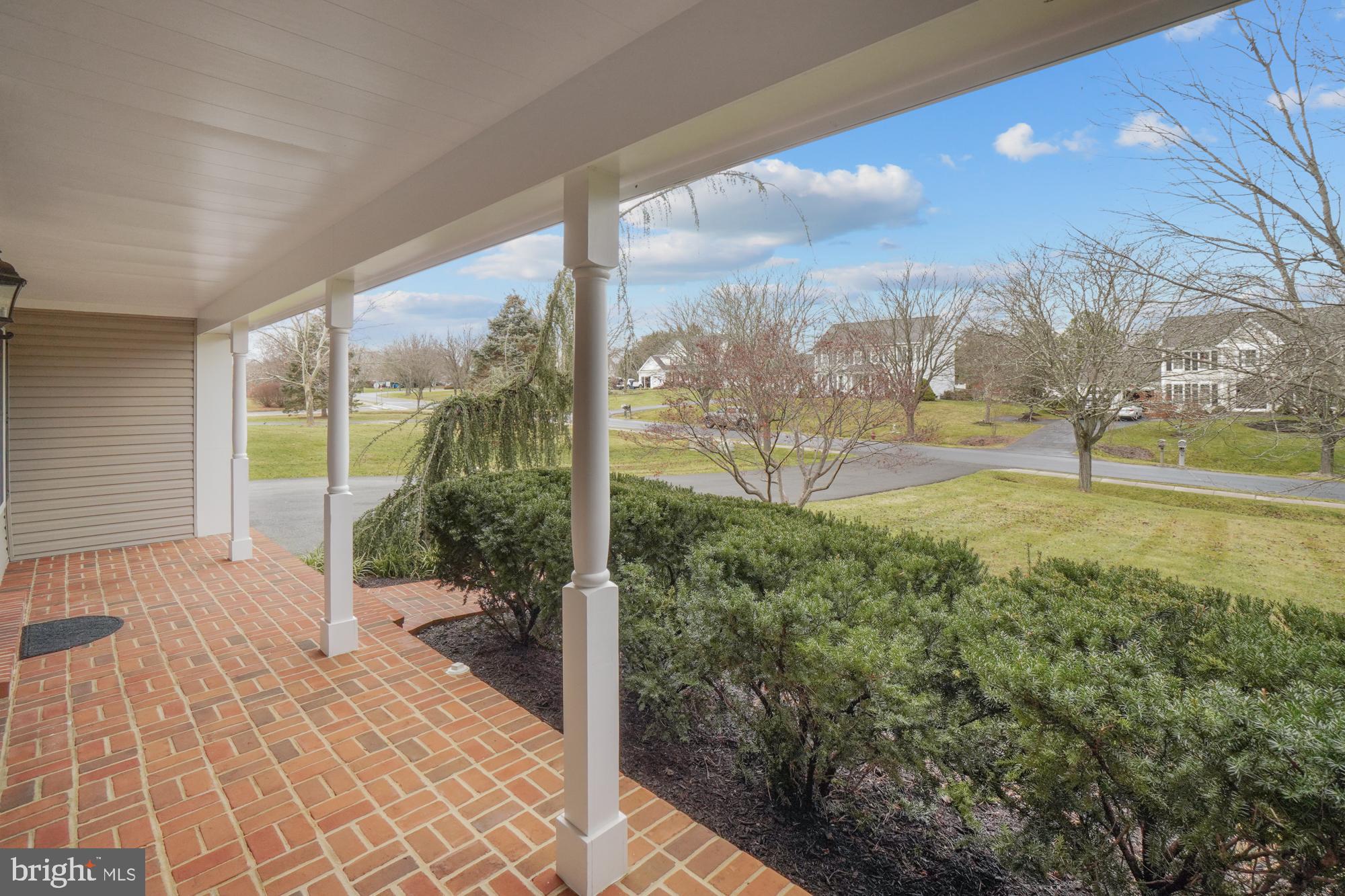 16908 Hoskinson Road Poolesville, MD 20837 - Photo 8 of 72 a view of a porch with a floor to ceiling window and outside view