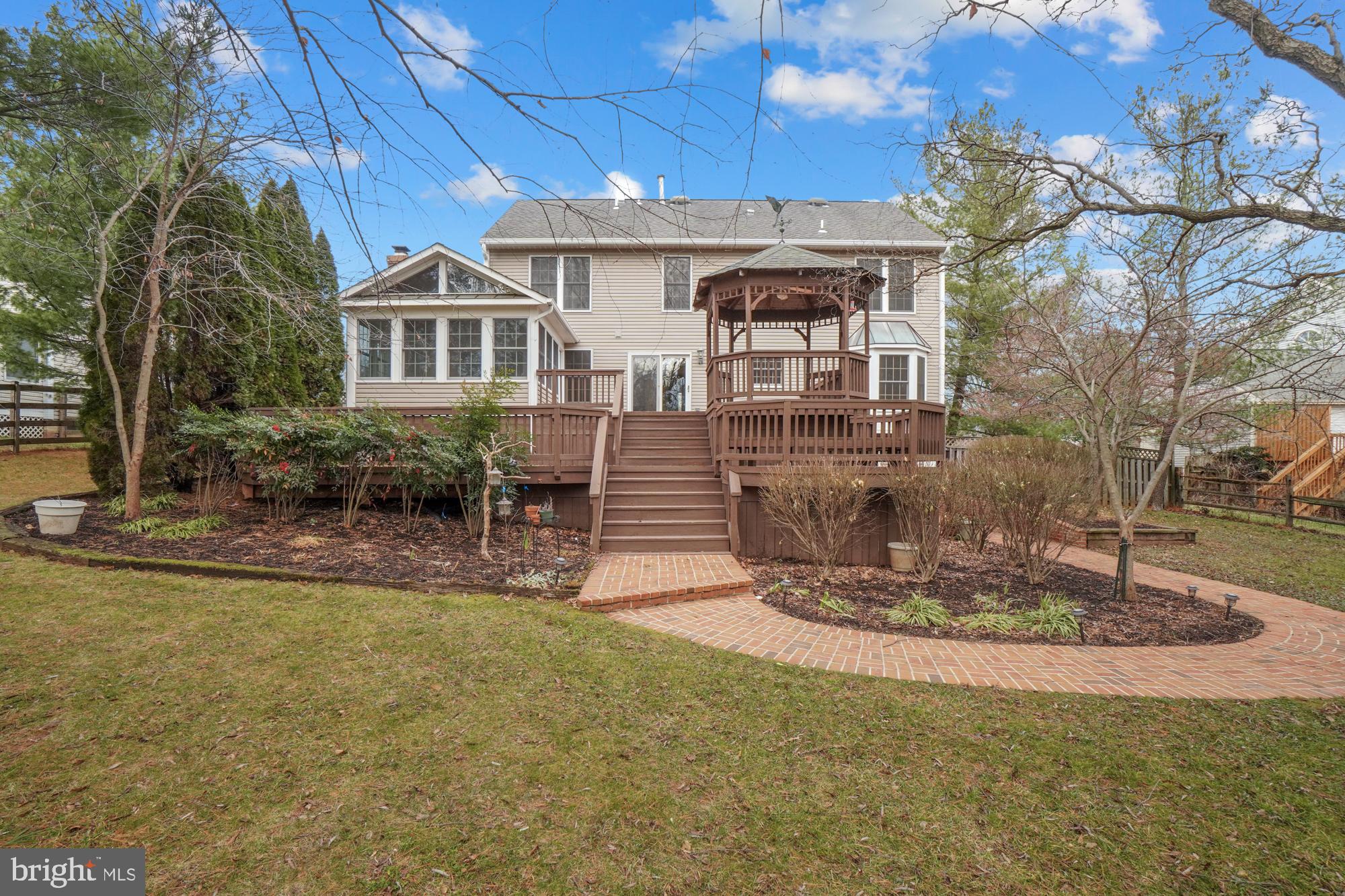16908 Hoskinson Road Poolesville, MD 20837 - Photo 10 of 72 a front view of a house with a yard