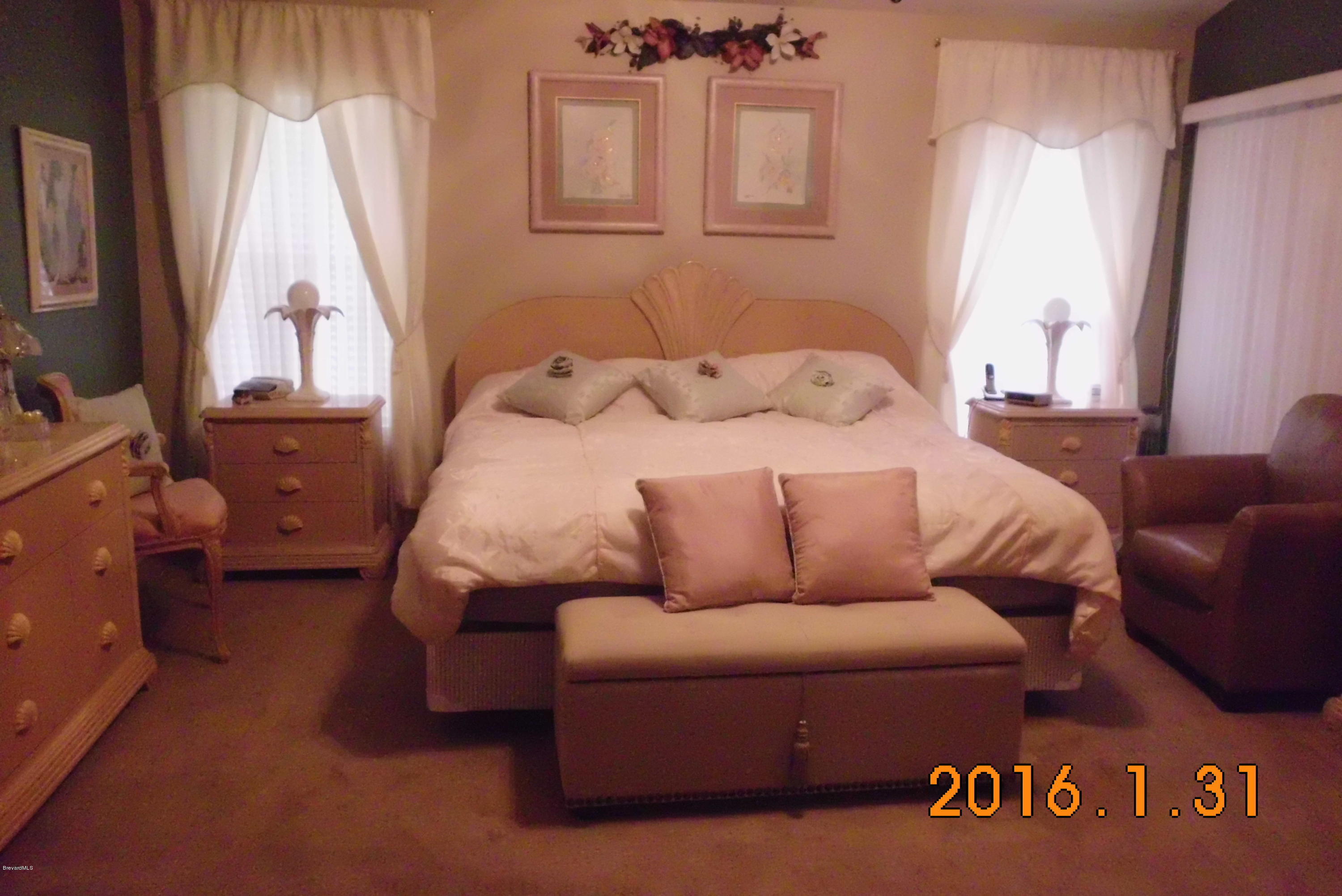 936 Tavernier Circle Northeast Palm Bay, FL 32905 - Photo 8 of 25 Master Bedroom