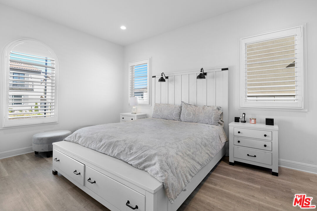 20234 Jubilee Way Porter Ranch, CA 91326 - Photo 26 of 30 a spacious bedroom with a bed and a window