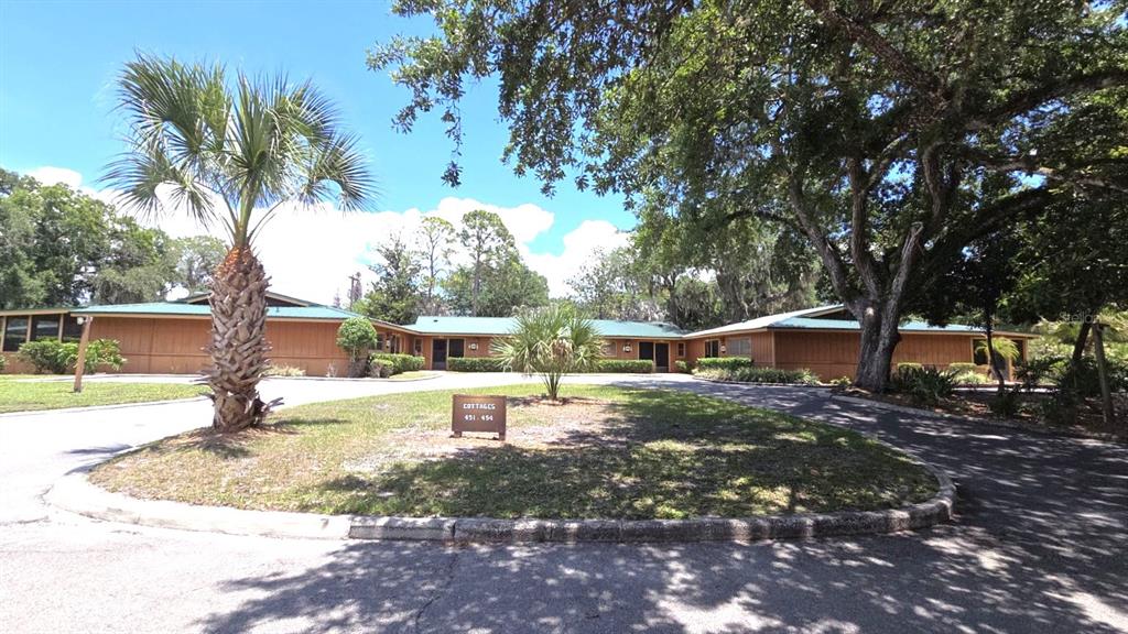 454 Cottage Circle, Unit 454 River Ranch, FL 33867 - Photo 1 of 27 a view of a backyard with swimming pool