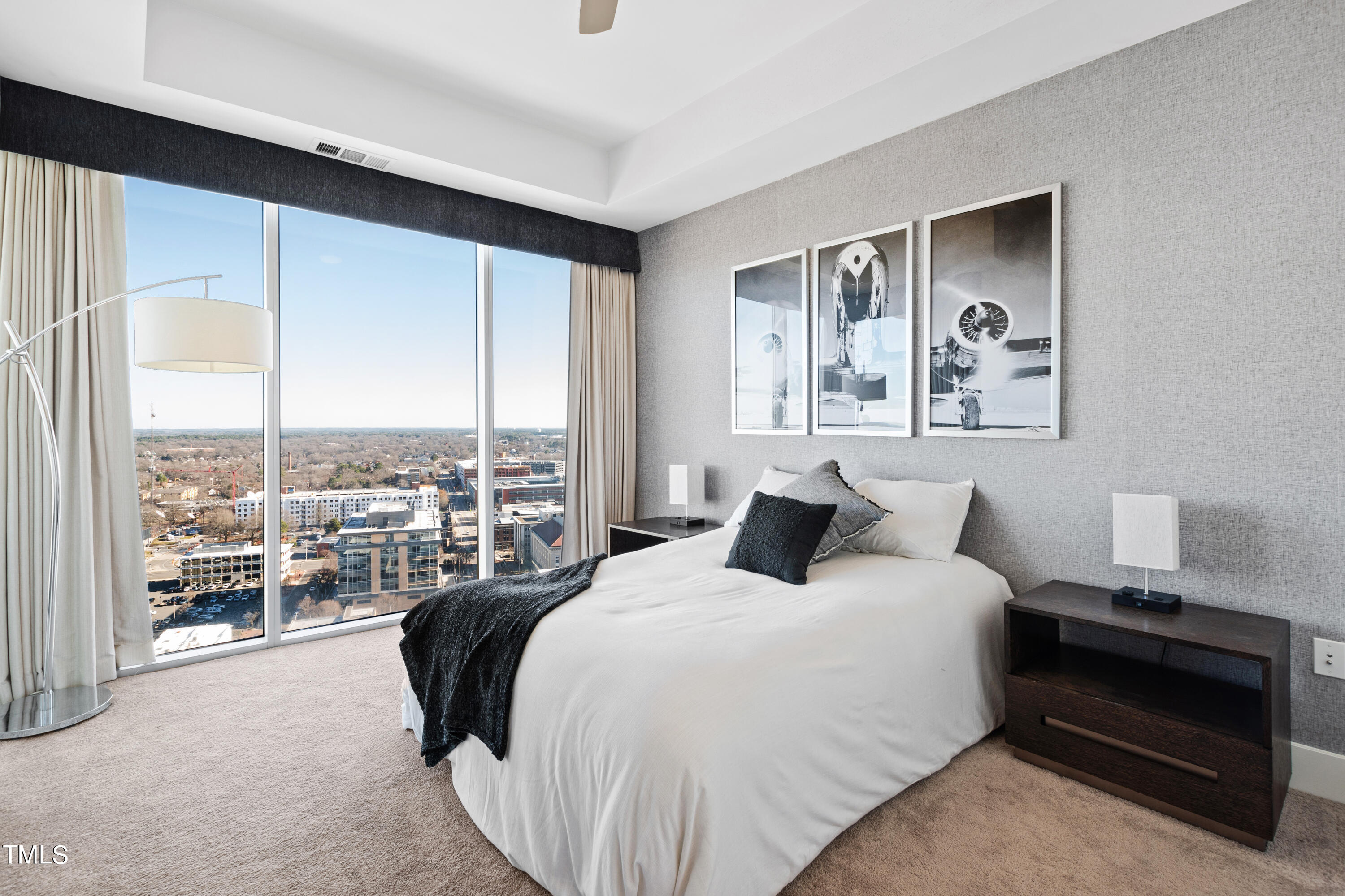 110 Corcoran Street, Unit 2204 Durham, NC 27701 - Photo 13 of 39 a bedroom with a bed and a large window