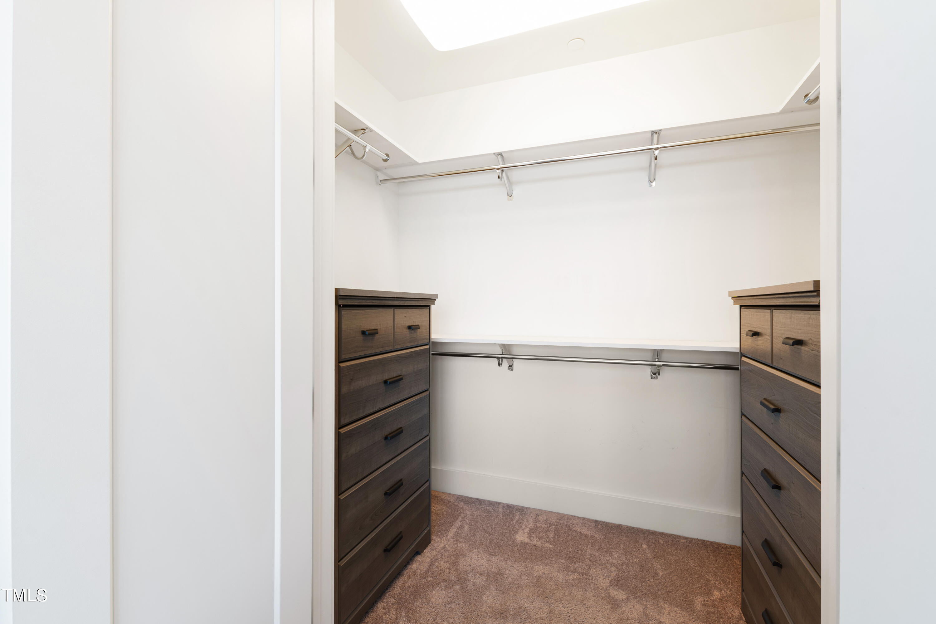 110 Corcoran Street, Unit 2204 Durham, NC 27701 - Photo 17 of 39 a view of walk in closet with empty racks
