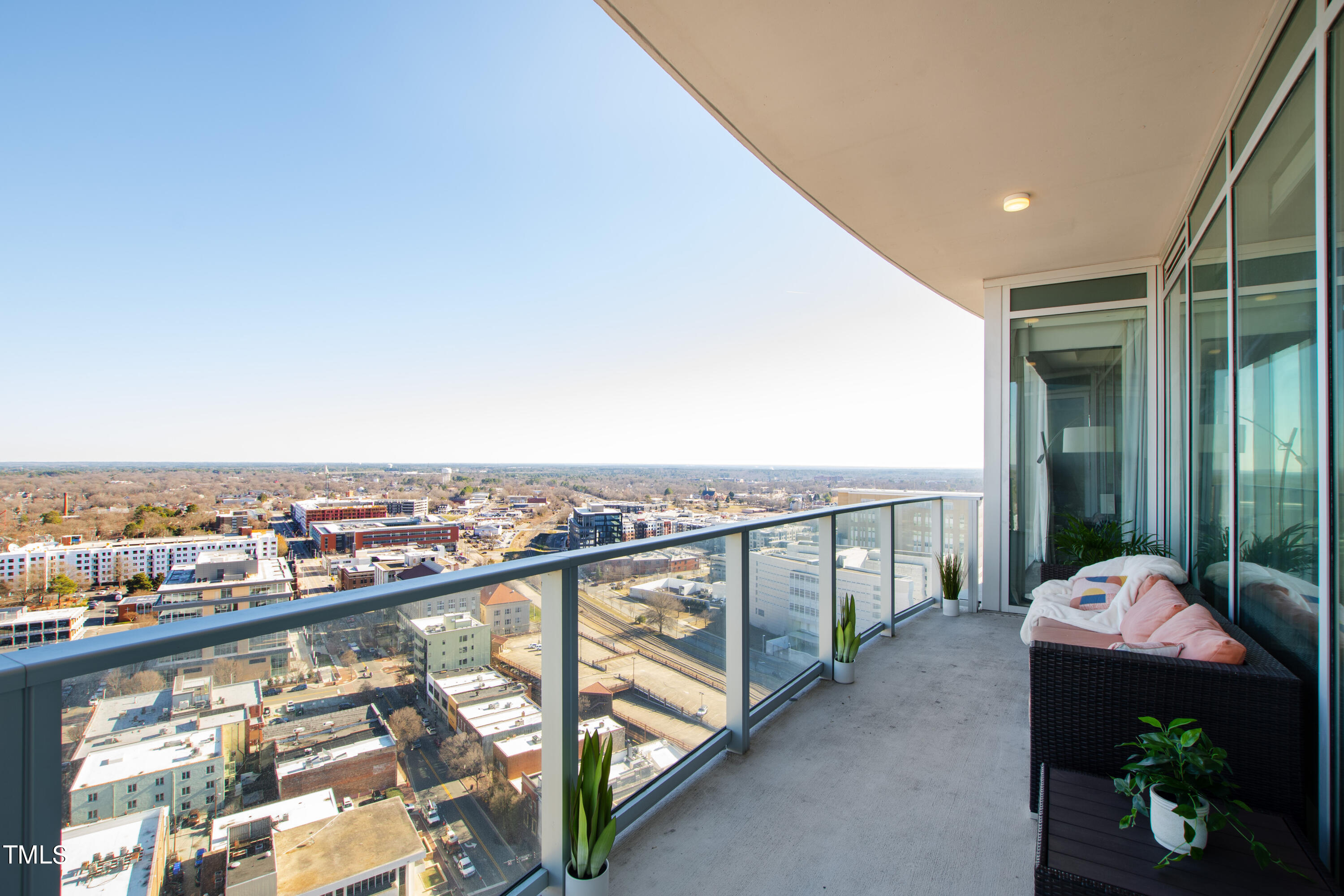 110 Corcoran Street, Unit 2204 Durham, NC 27701 - Photo 2 of 39 a balcony with an outdoor seating
