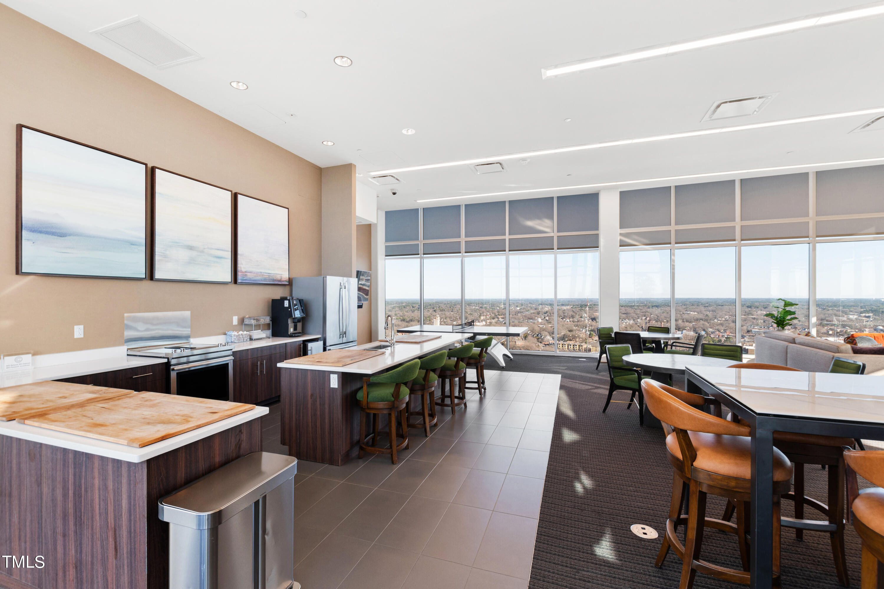 110 Corcoran Street, Unit 2204 Durham, NC 27701 - Photo 25 of 39 a kitchen with lots of counter top space and dining table