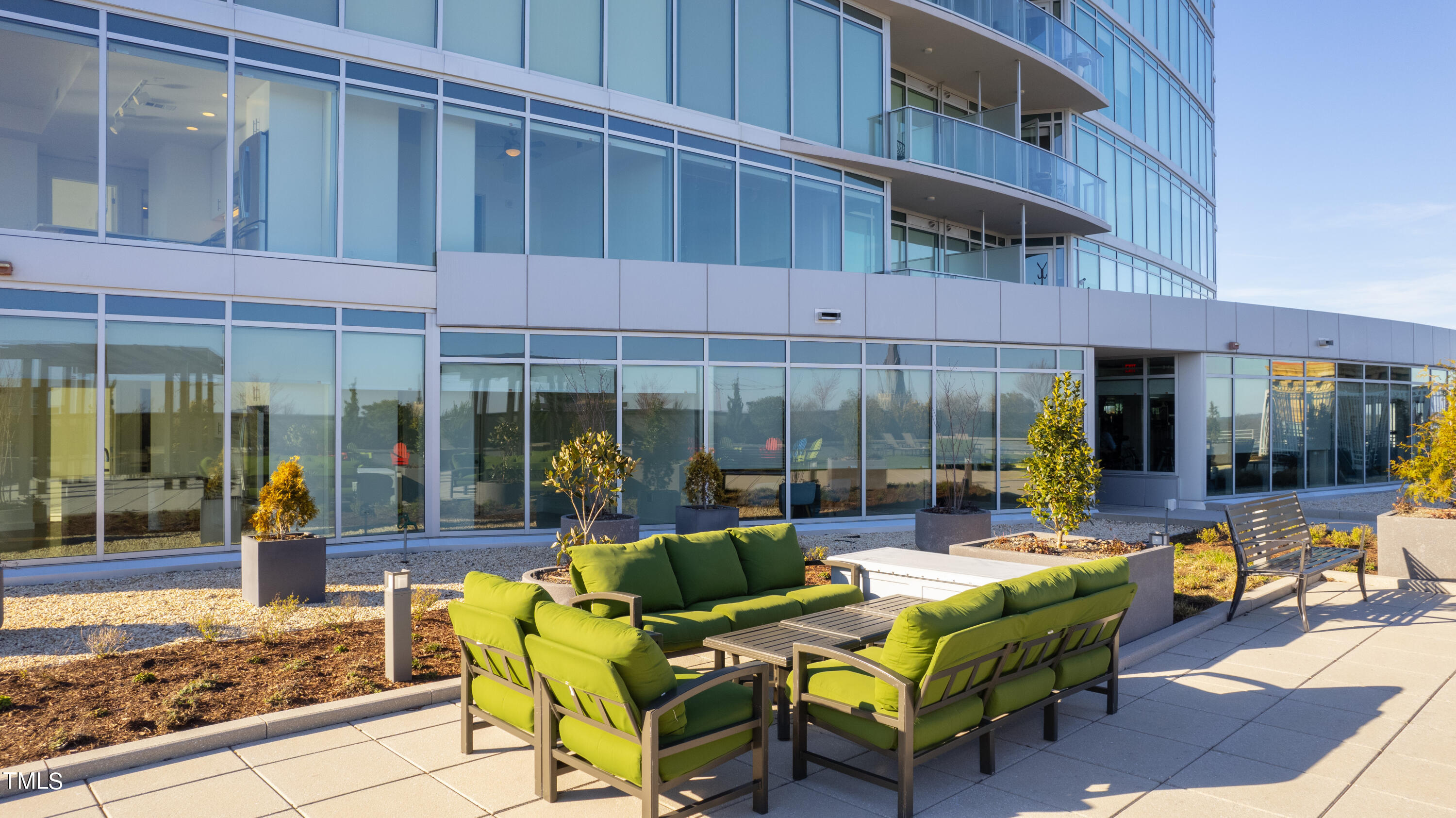 110 Corcoran Street, Unit 2204 Durham, NC 27701 - Photo 29 of 39 a view of a chairs with potted plants on the deck