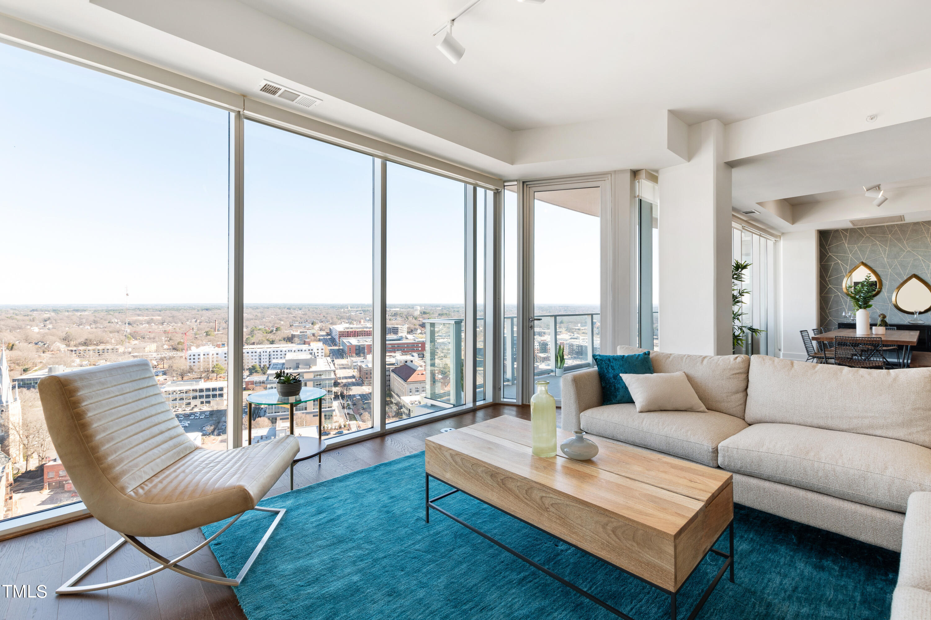 110 Corcoran Street, Unit 2204 Durham, NC 27701 - Photo 3 of 39 a living room with furniture and a large window
