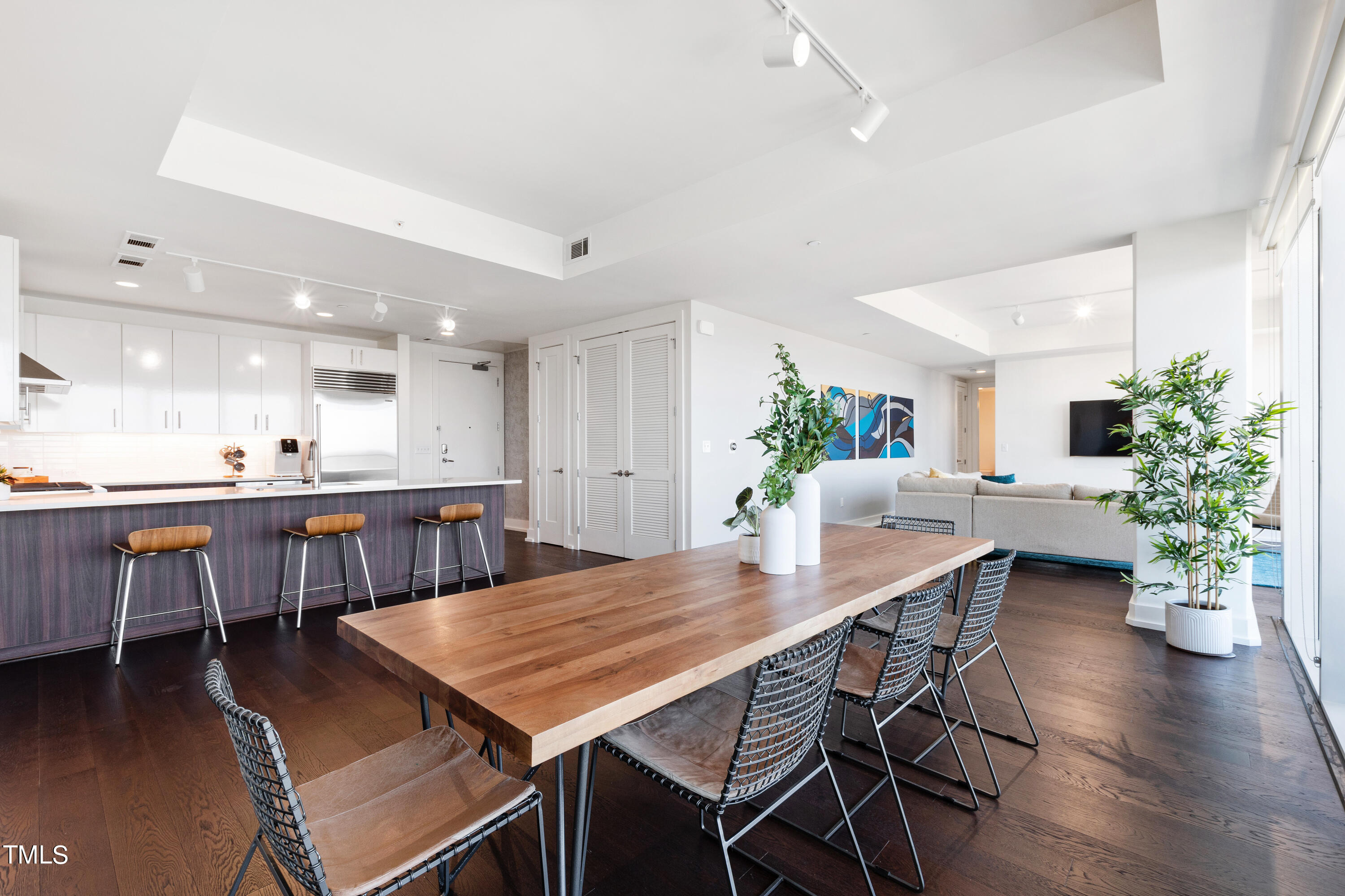 110 Corcoran Street, Unit 2204 Durham, NC 27701 - Photo 6 of 39 a view of a dining room with furniture window and wooden floor