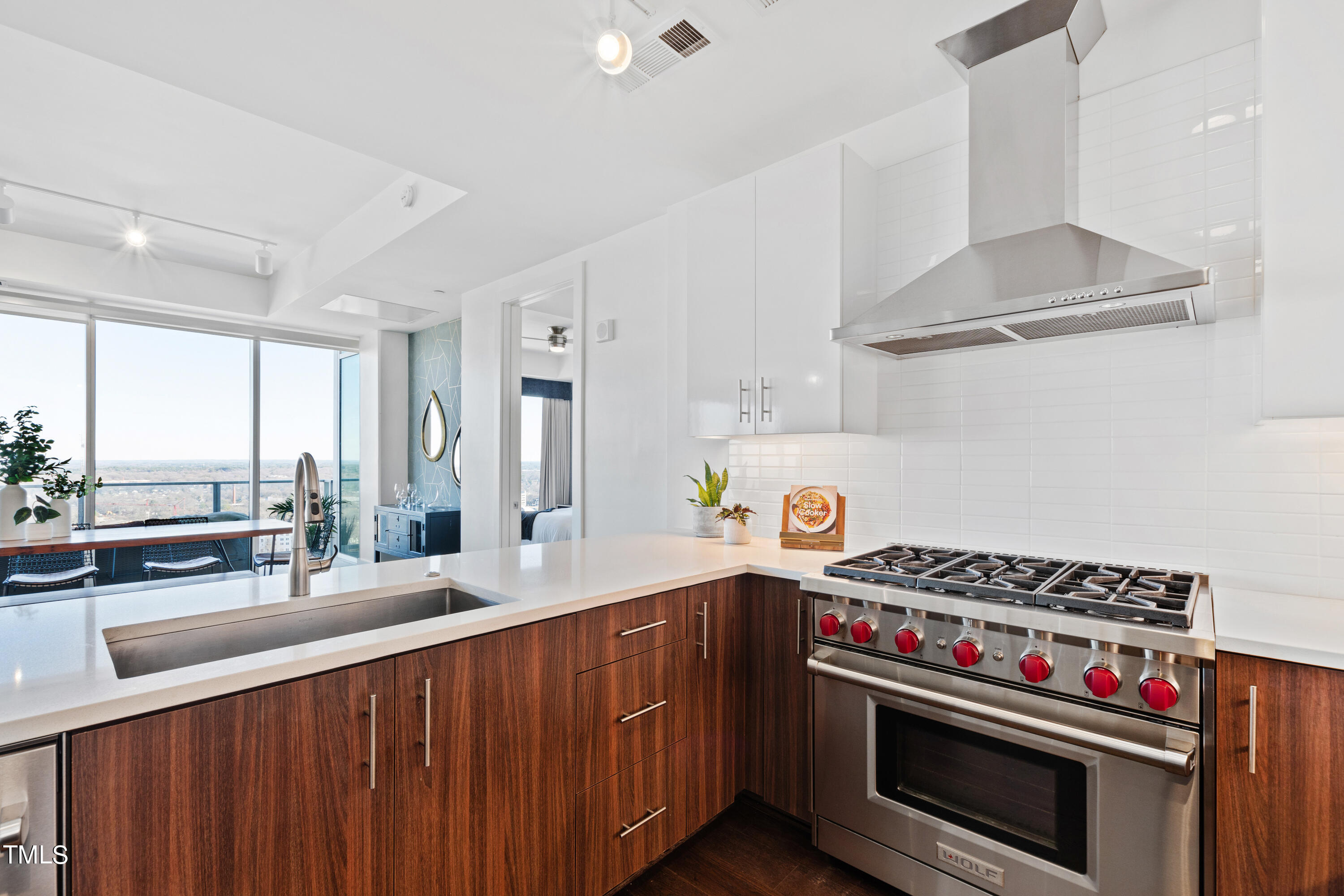 110 Corcoran Street, Unit 2204 Durham, NC 27701 - Photo 8 of 39 a kitchen with a stove and a sink