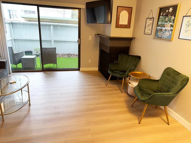 a dining room with furniture and window