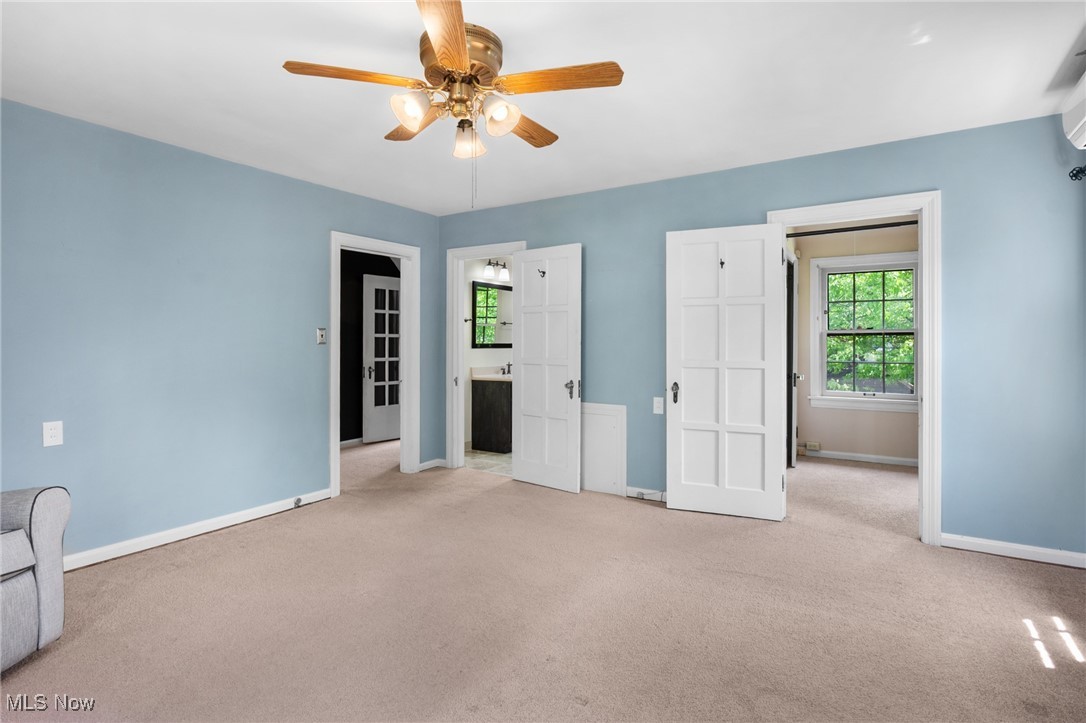 3677 Traver Road Shaker Heights, OH 44122 - Photo 16 of 35 Unfurnished bedroom with carpet, baseboards, ceiling fan, and ensuite bathroom