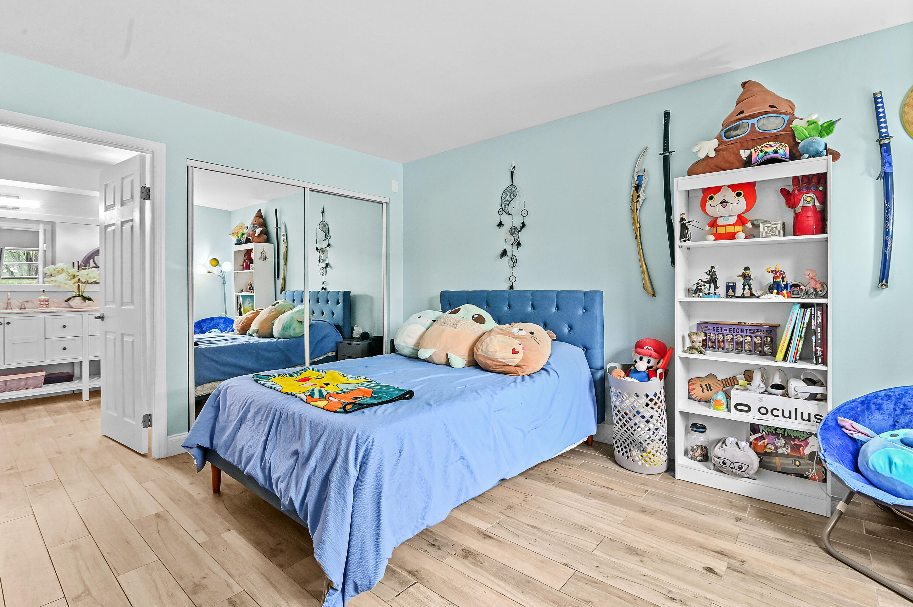 6400 Northwest 2nd Avenue, Unit 124 Boca Raton, FL 33487 - Photo 23 of 33 a bedroom with bed and wooden floor