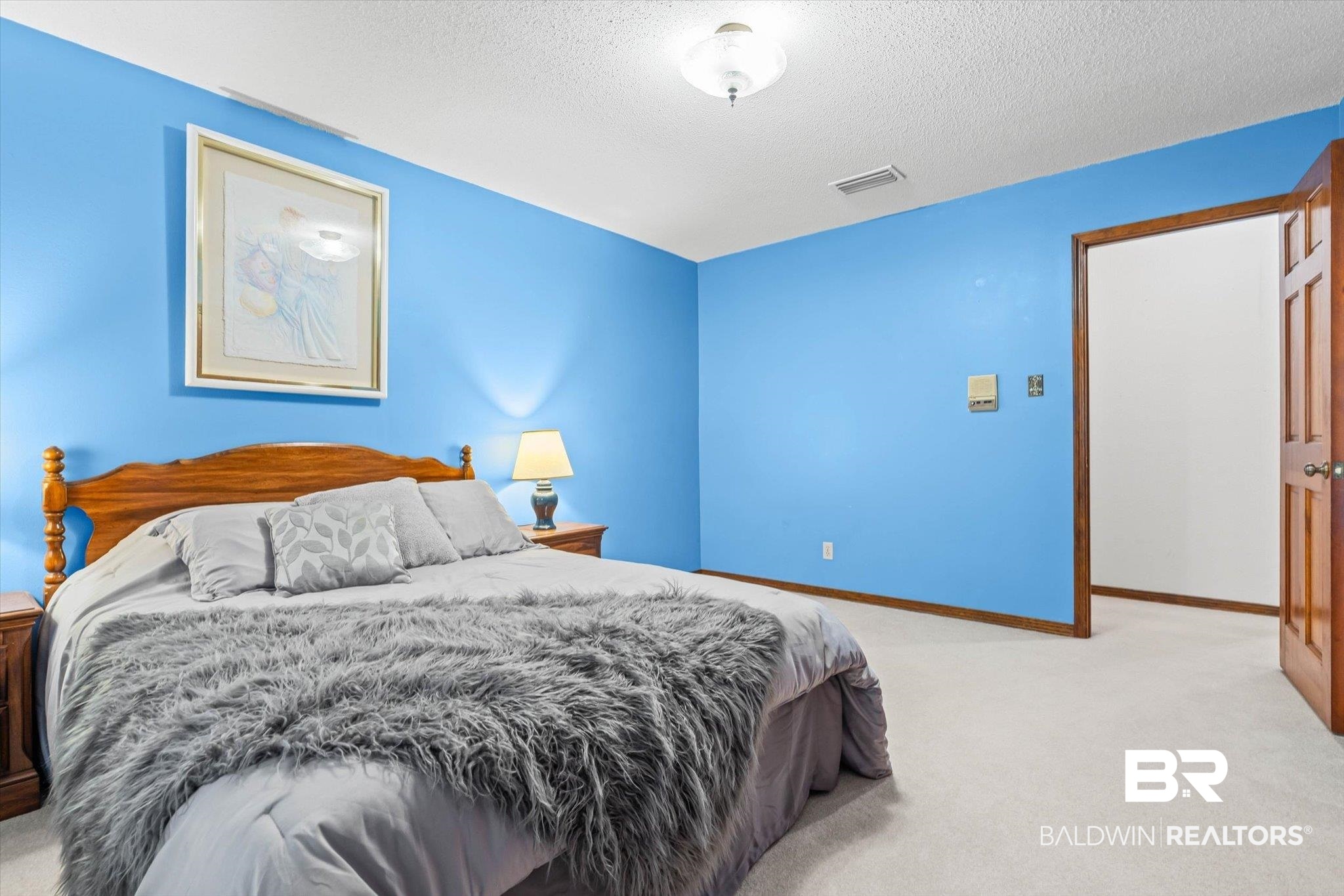1900 Foxfire Road Mobile, AL 36618 - Photo 20 of 36 Bedroom featuring light colored carpet and a textured ceiling