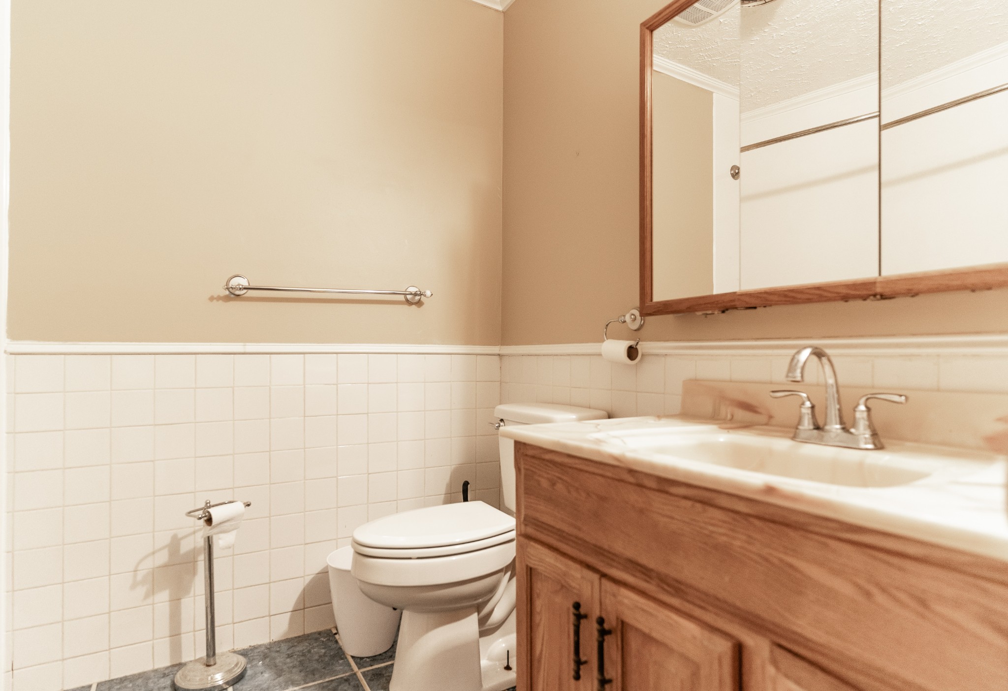 321 Warrior Road Madison, TN 37115 - Photo 9 of 15 a bathroom with a granite countertop toilet sink and mirror