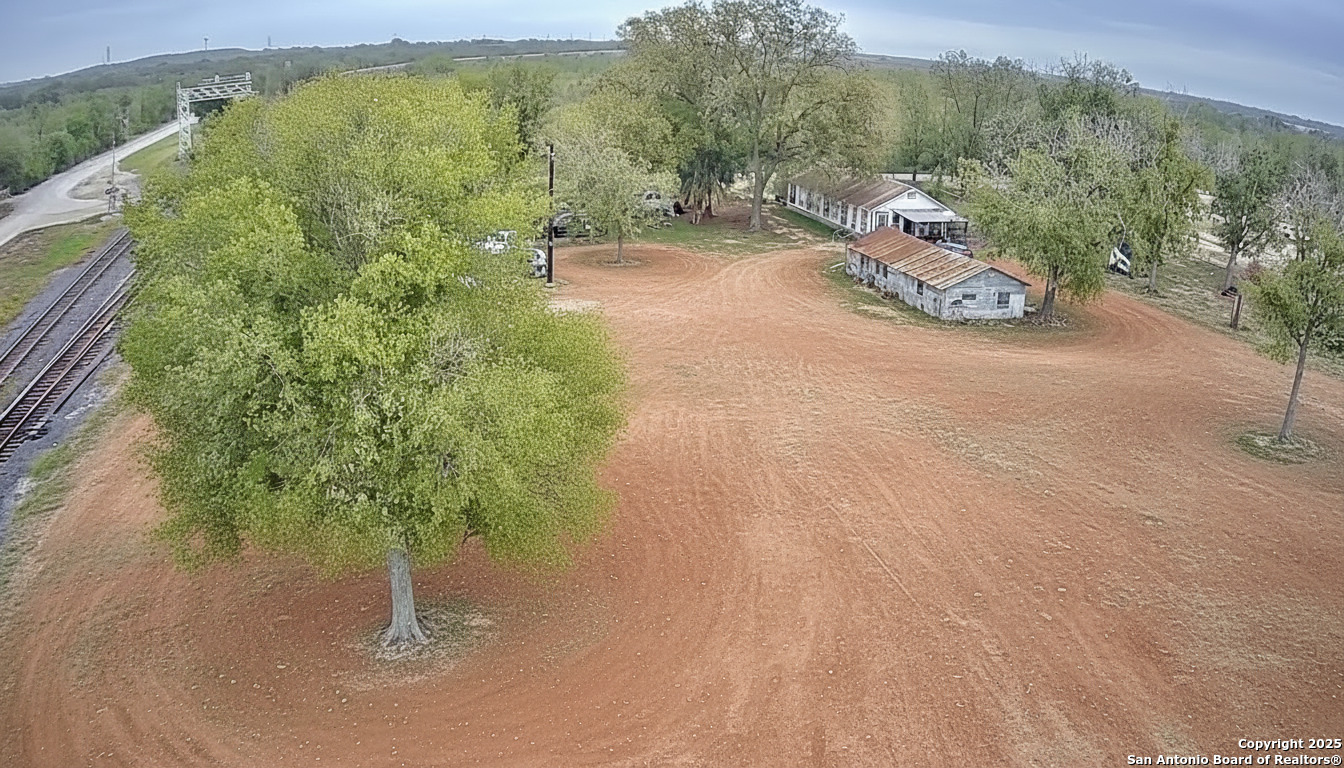 9221 Nelson Road San Antonio, TX 78252 - Photo 18 of 22 a view of a road with a yard