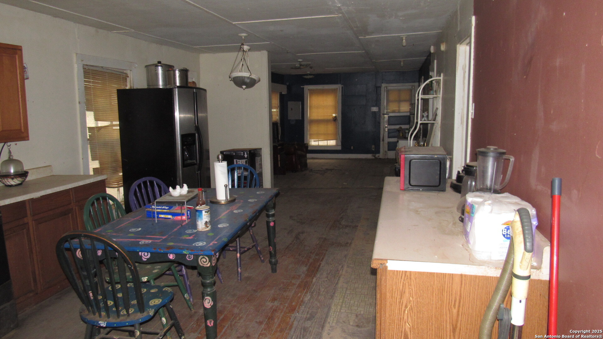 9221 Nelson Road San Antonio, TX 78252 - Photo 5 of 22 a dining room with furniture and wooden floor