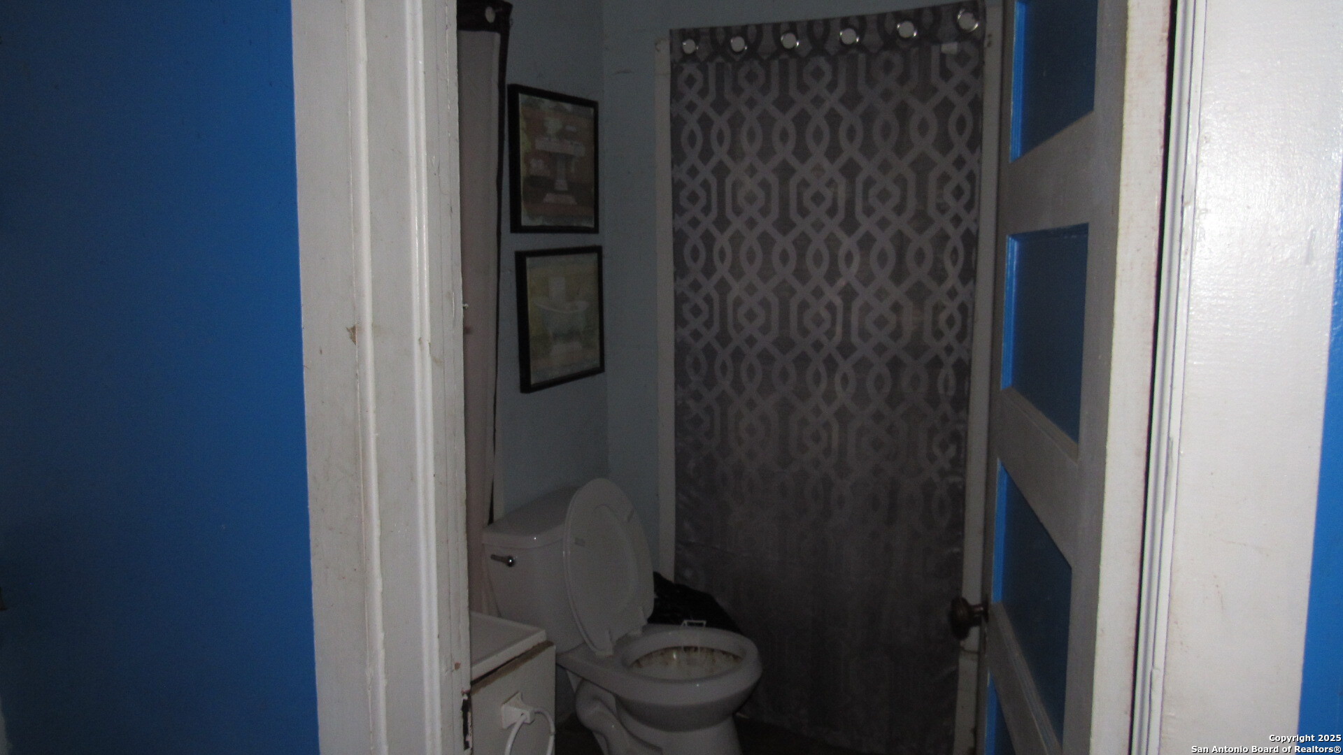 9221 Nelson Road San Antonio, TX 78252 - Photo 7 of 22 a bathroom with a toilet and a shower