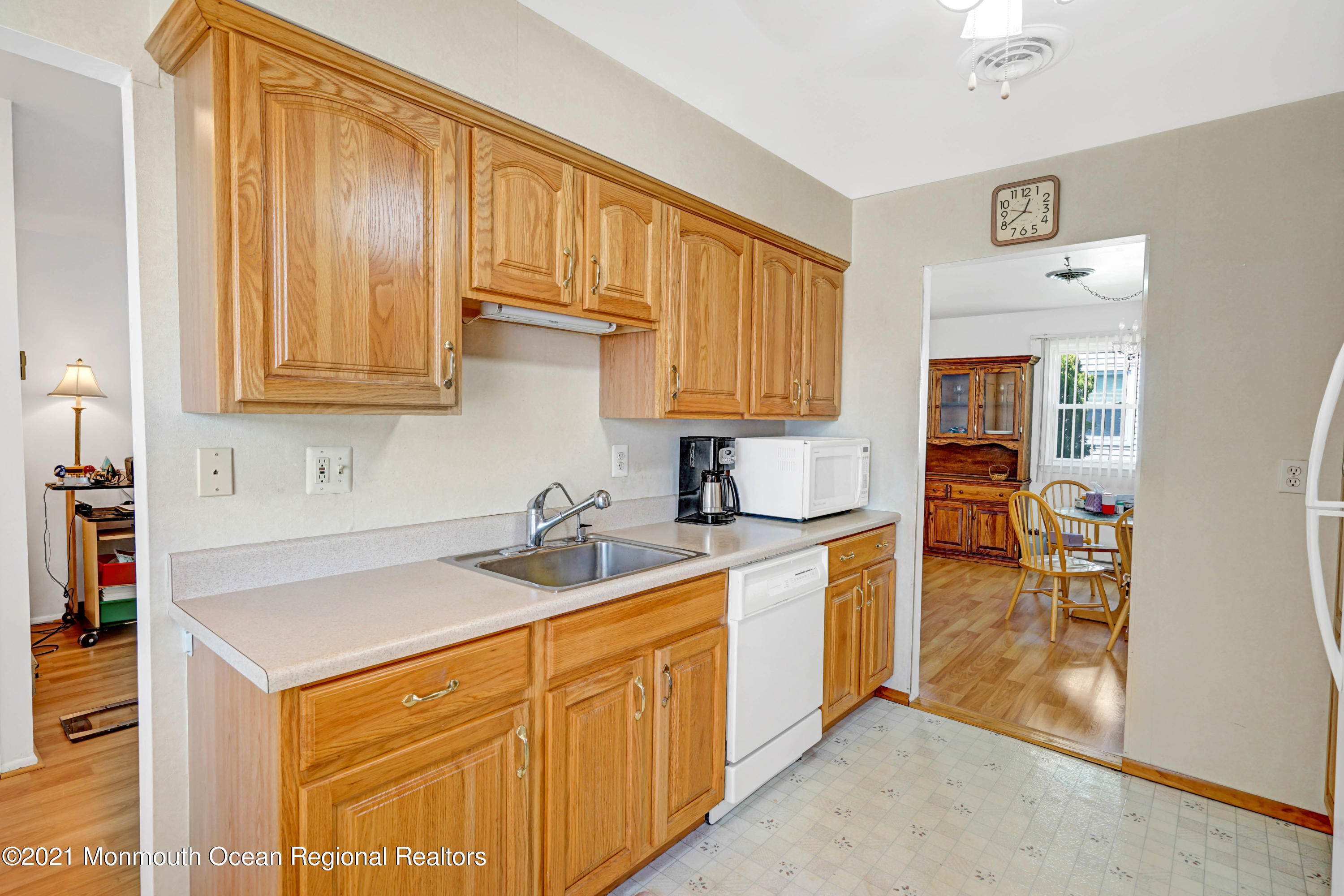 44 Churchill Road, Unit 71 Whiting, NJ 08759 - Photo 13 of 17 a kitchen with stainless steel appliances granite countertop a sink stove and cabinets