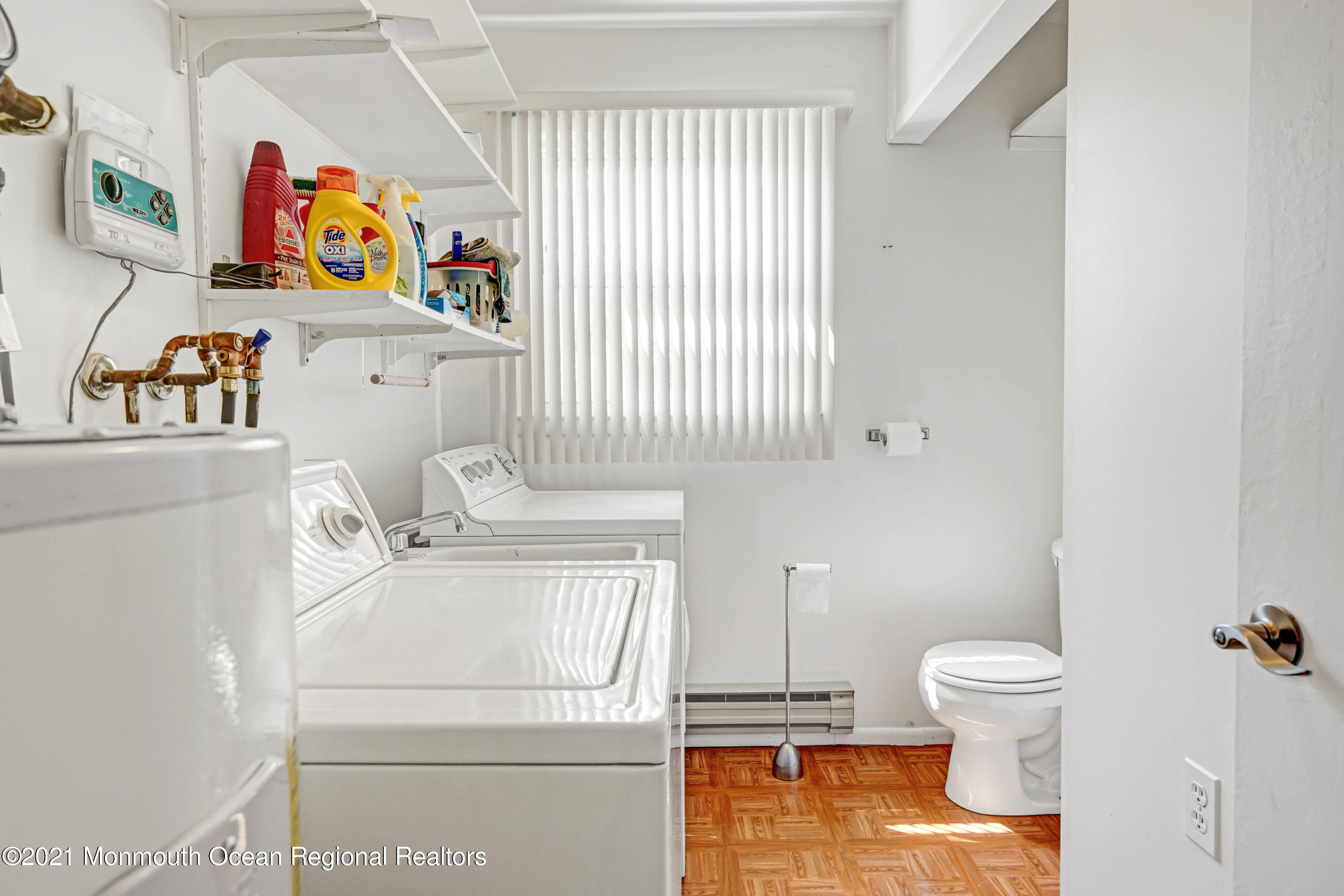 44 Churchill Road, Unit 71 Whiting, NJ 08759 - Photo 15 of 17 a bathroom with a toilet a sink and a window