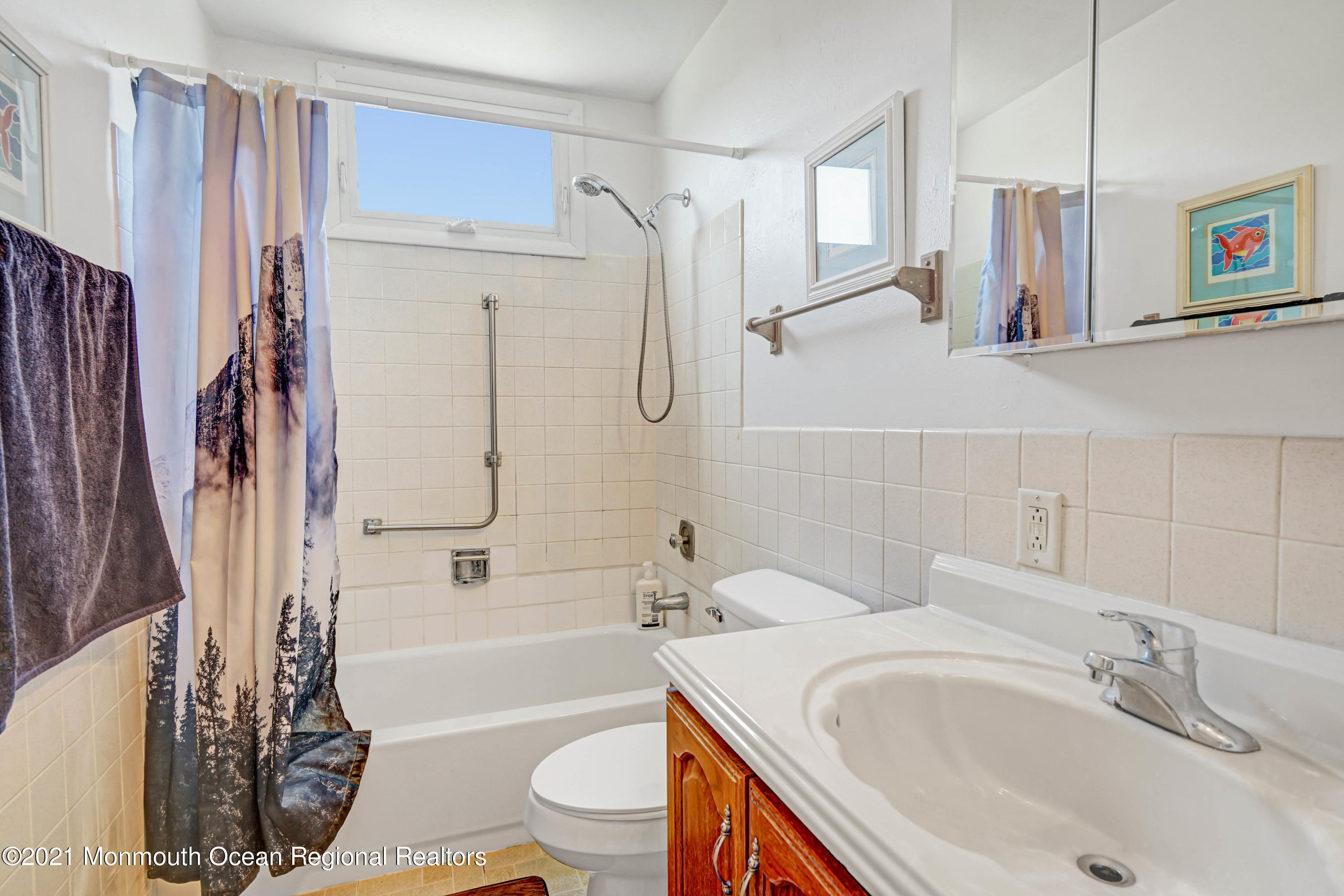 44 Churchill Road, Unit 71 Whiting, NJ 08759 - Photo 16 of 17 a bathroom with a sink toilet and shower
