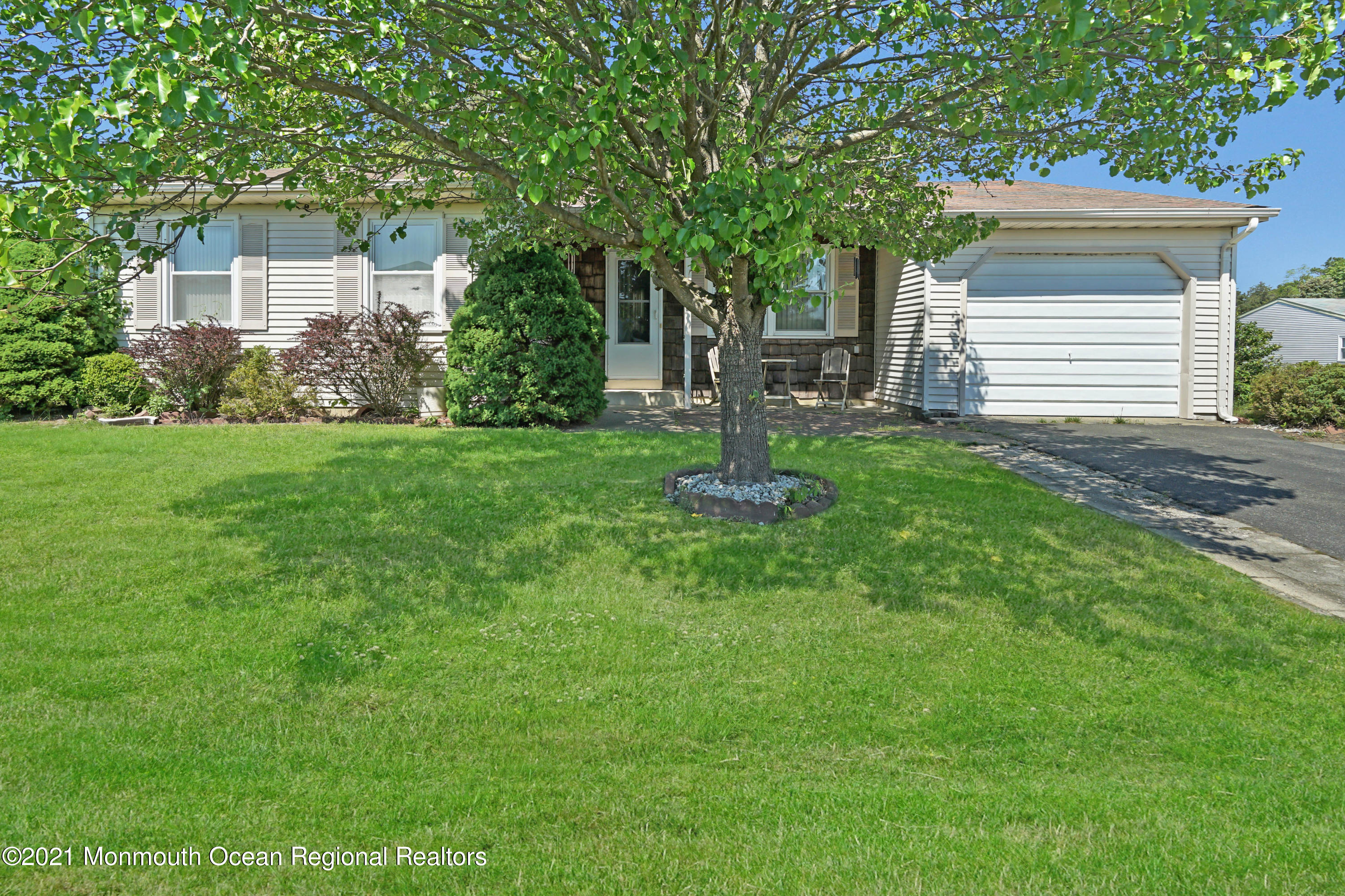 44 Churchill Road, Unit 71 Whiting, NJ 08759 - Photo 4 of 17 a front view of a house with a garden