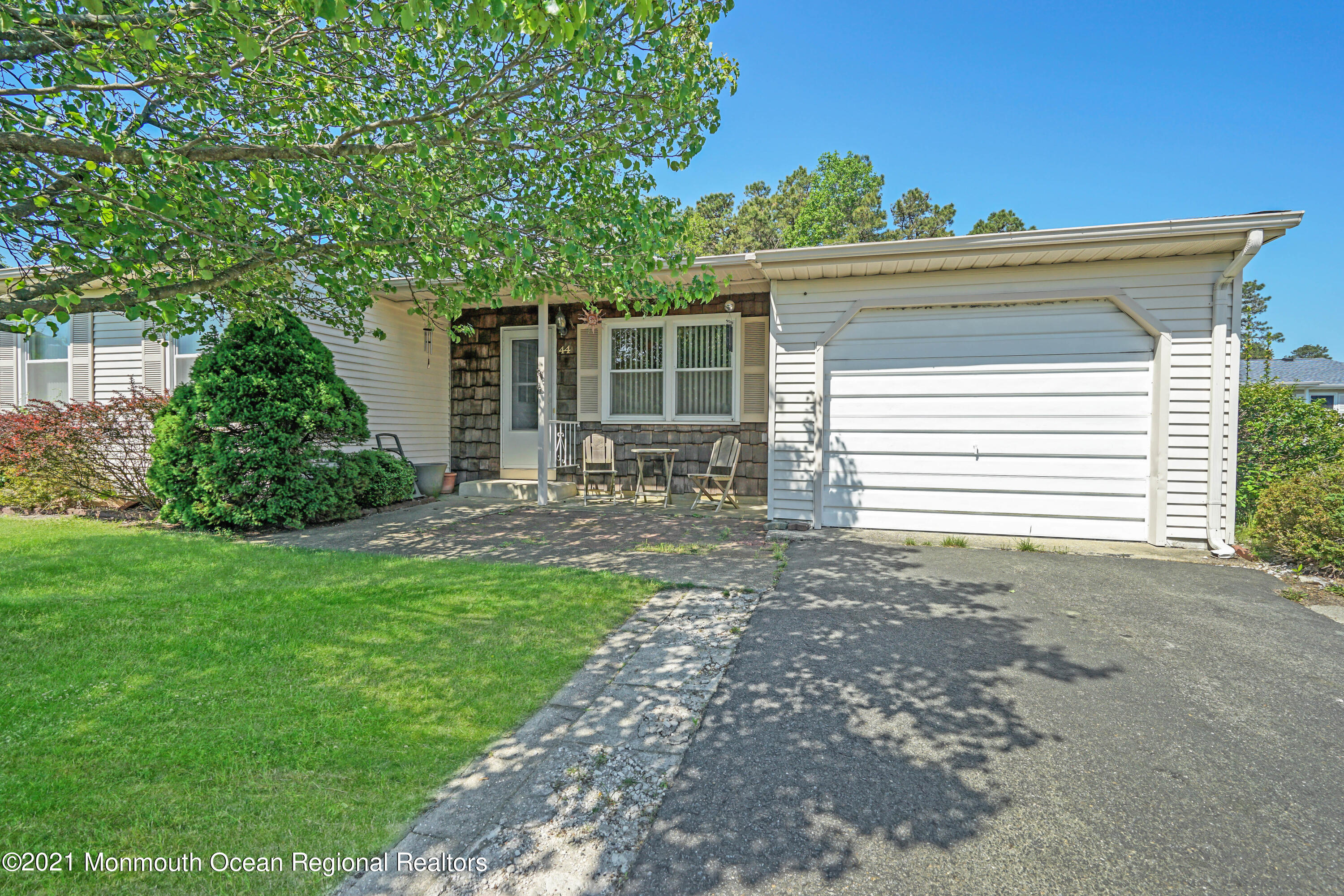 44 Churchill Road, Unit 71 Whiting, NJ 08759 - Photo 6 of 17 a view of a house with backyard and garden