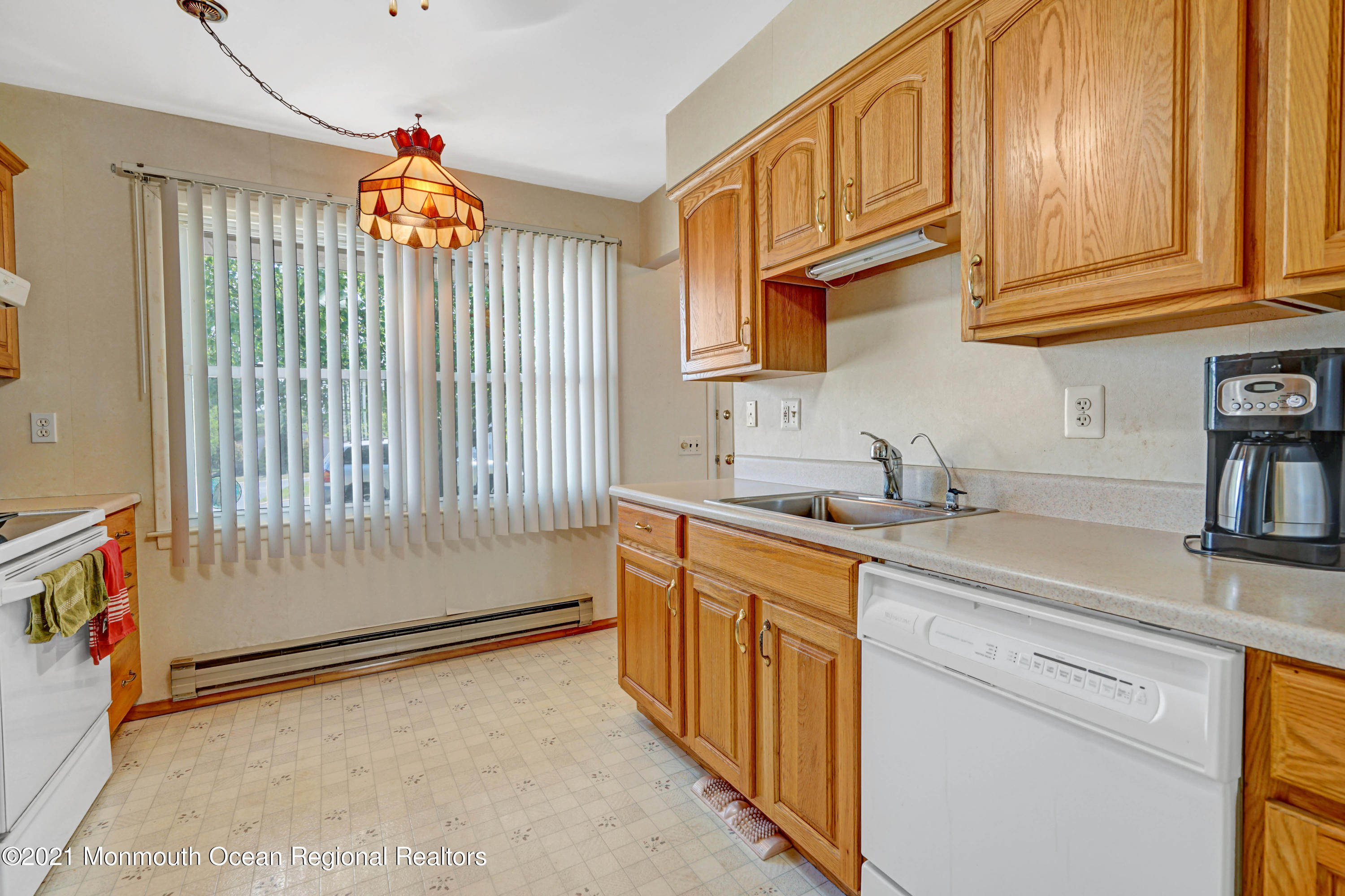 44 Churchill Road, Unit 71 Whiting, NJ 08759 - Photo 10 of 17 a kitchen with stainless steel appliances granite countertop a sink and a cabinets