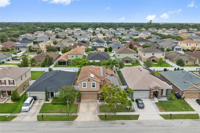 an aerial view of a house with a garden