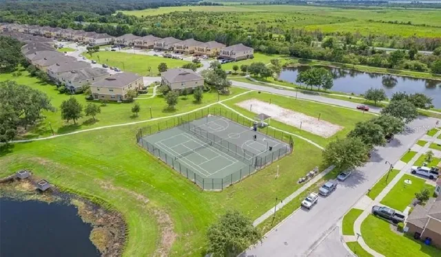an aerial view of a house with a swimming pool