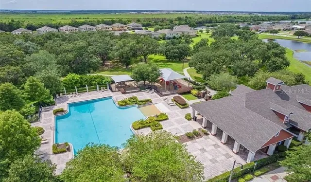an aerial view of a house with a garden