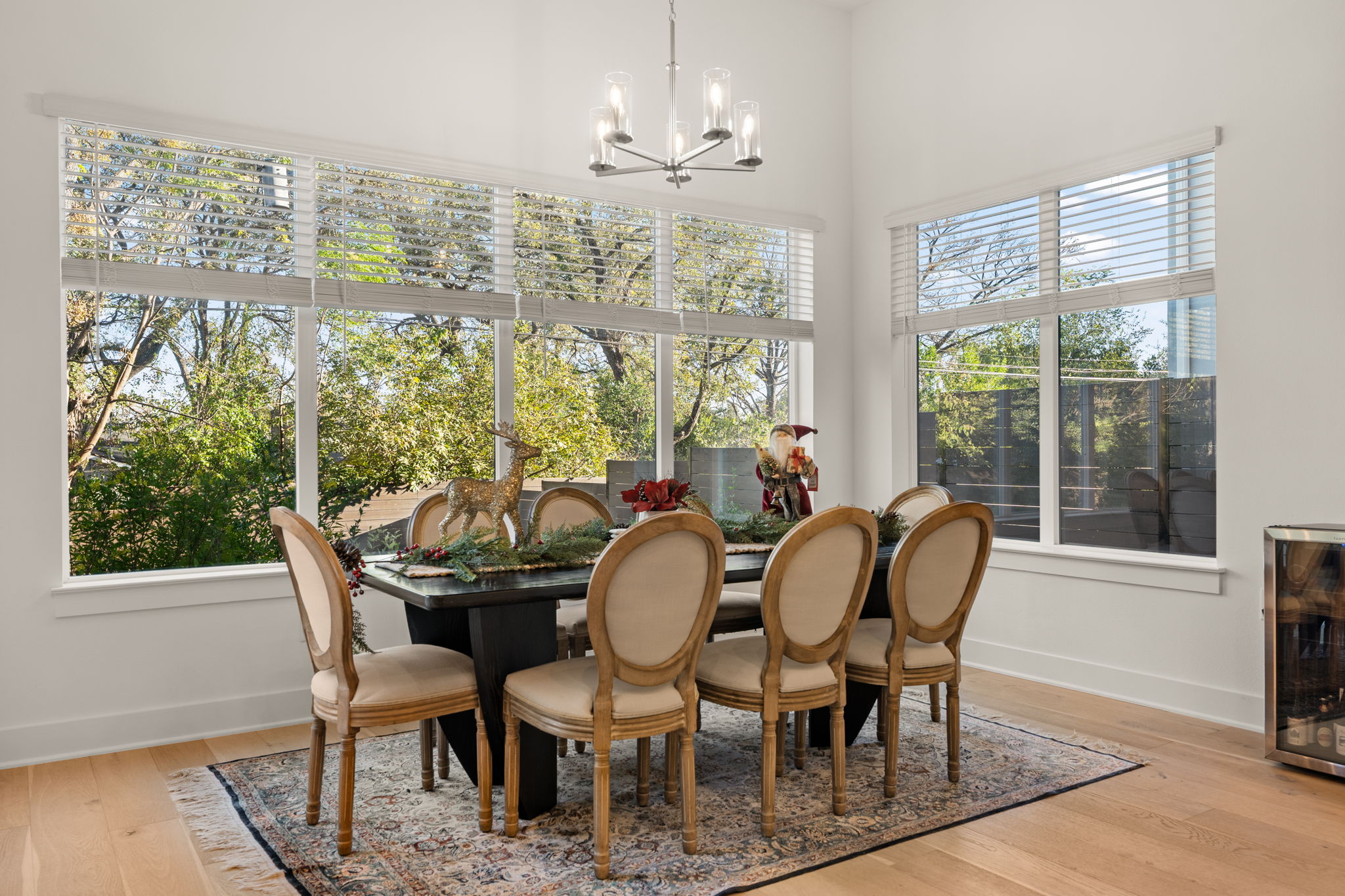 4003 Independent Way, Unit 182 Austin, TX 78731 - Photo 12 of 40 a dining room with furniture a chandelier and wooden floor