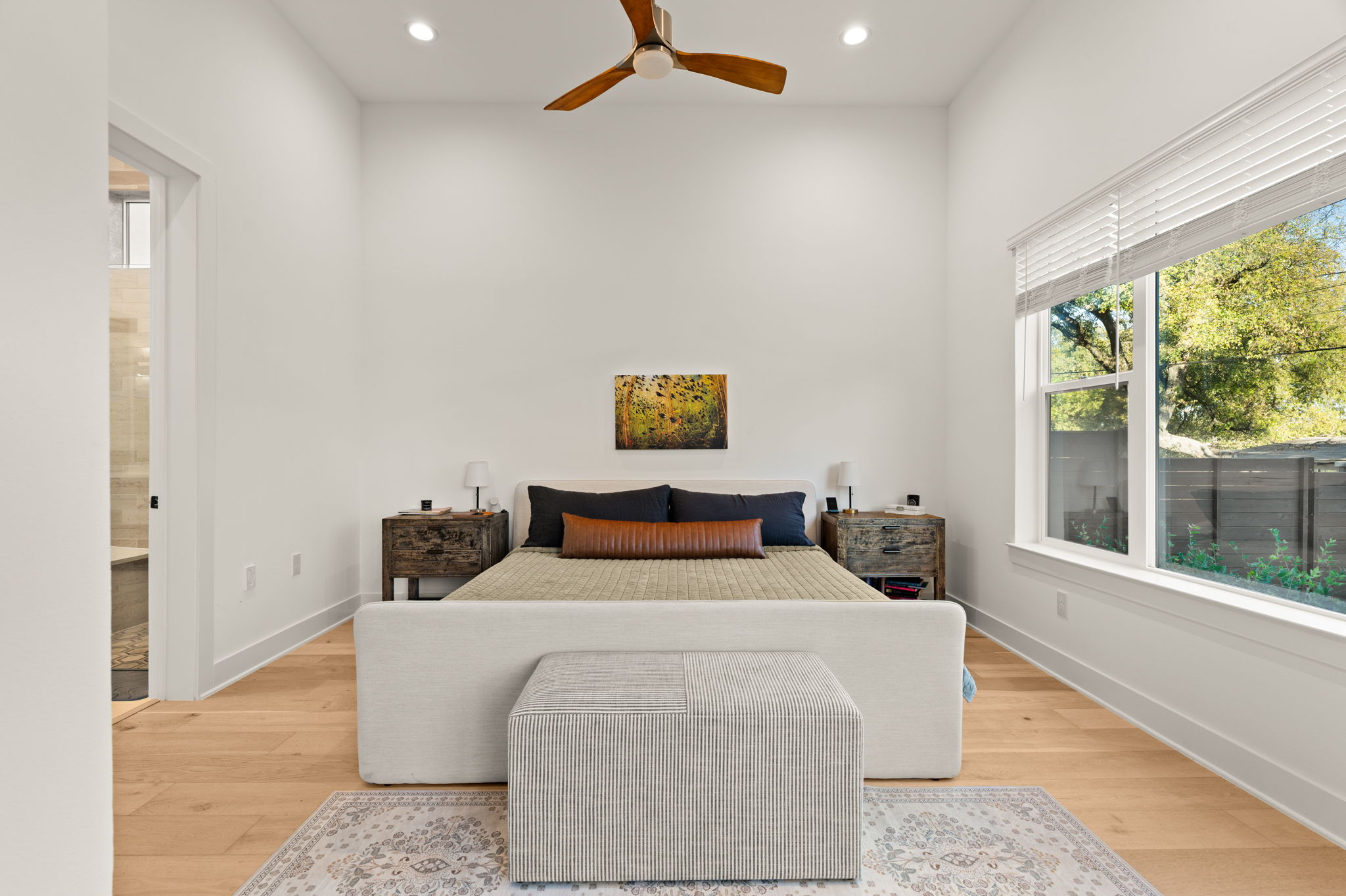 4003 Independent Way, Unit 182 Austin, TX 78731 - Photo 14 of 40 a bedroom with a bed and glass window