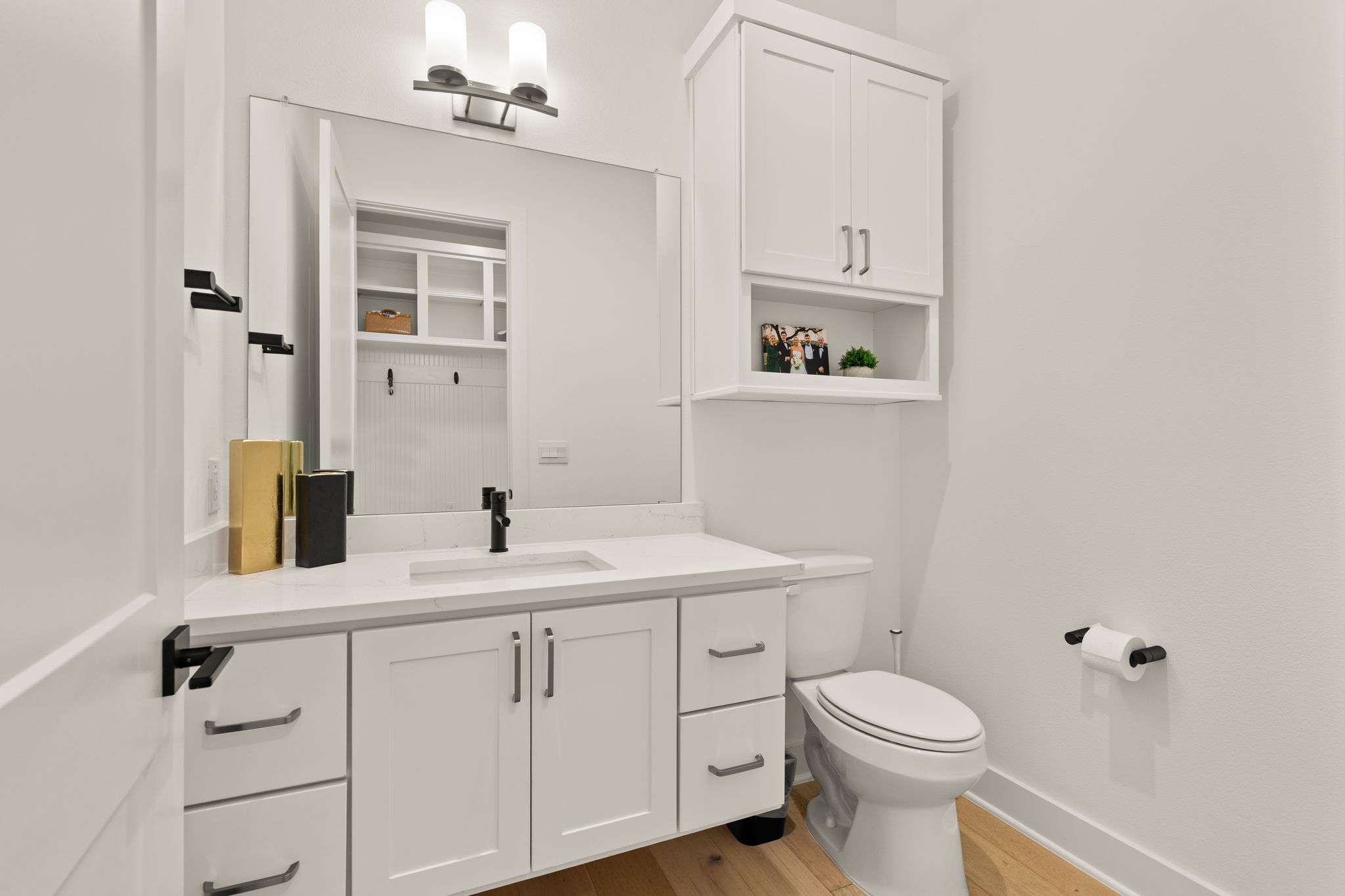 4003 Independent Way, Unit 182 Austin, TX 78731 - Photo 19 of 40 Half bathroom with vanity and light wood-type flooring
