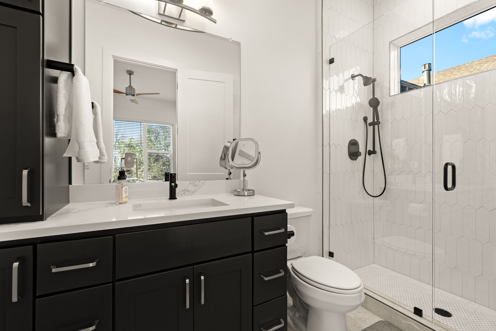 4003 Independent Way, Unit 182 Austin, TX 78731 - Photo 23 of 40 a bathroom with a sink toilet and shower