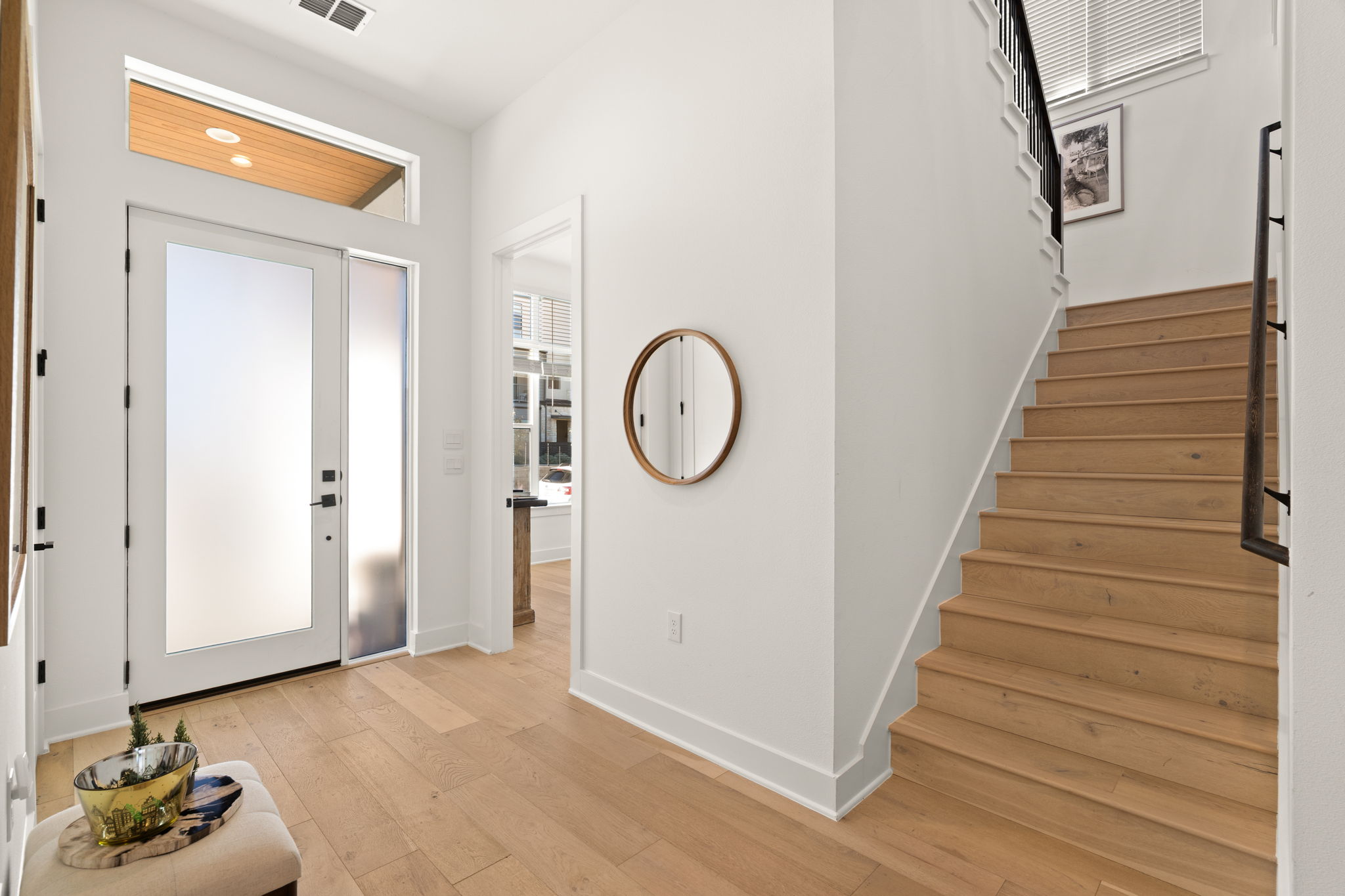 4003 Independent Way, Unit 182 Austin, TX 78731 - Photo 3 of 40 a view of a hallway with entryway wooden floor and front door