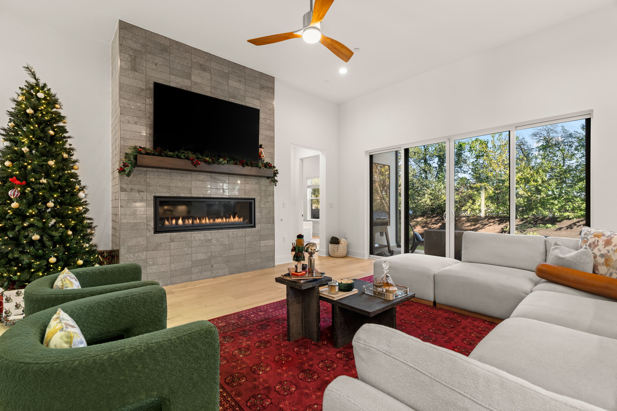 4003 Independent Way, Unit 182 Austin, TX 78731 - Photo 6 of 40 a living room with furniture a flat screen tv and a fireplace