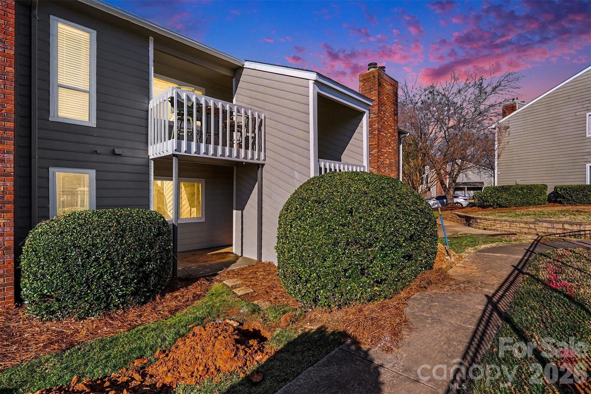 6148 Heath Ridge Court Charlotte, NC 28210 - Photo 1 of 27 a view of a house with a garden