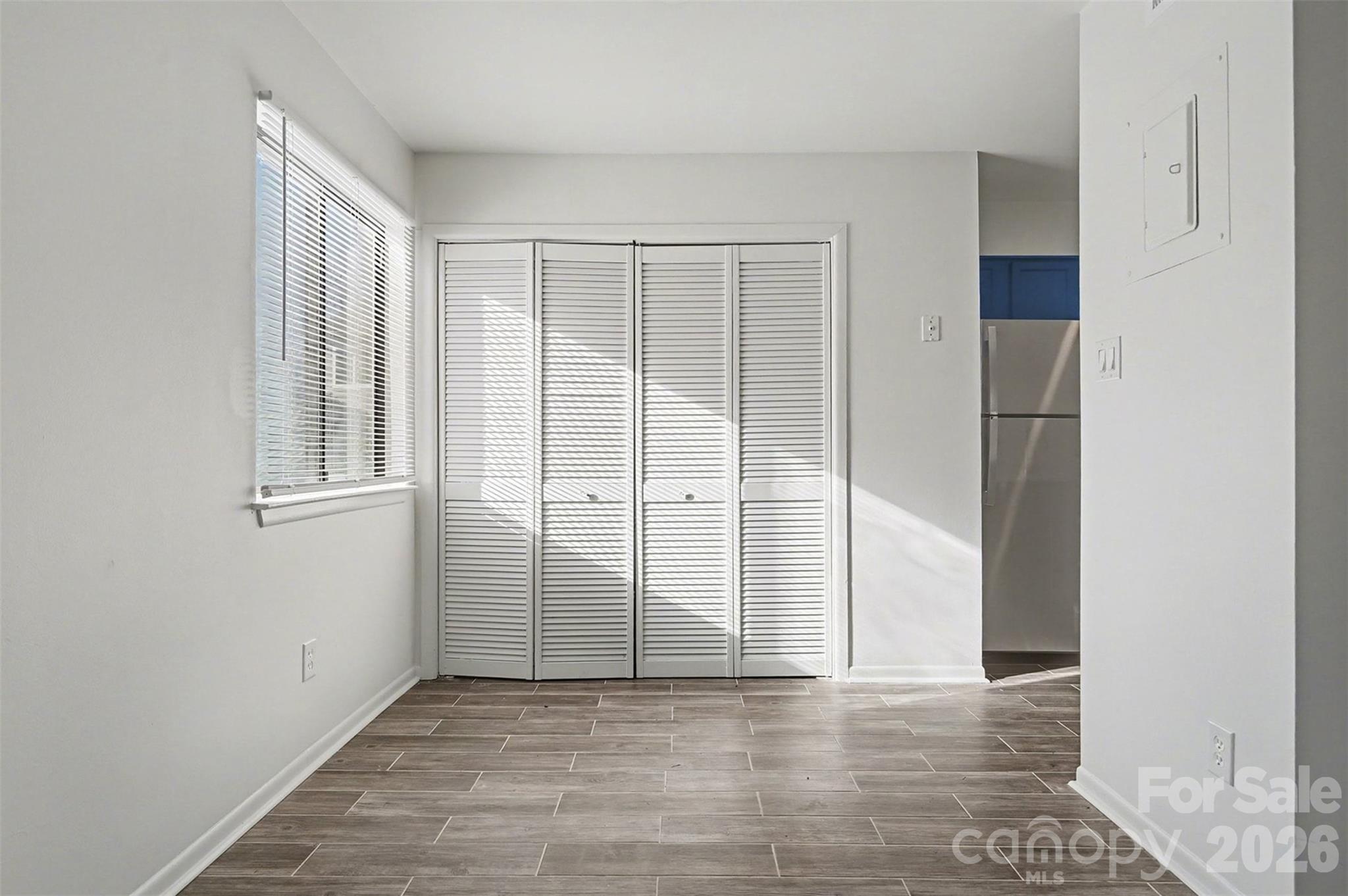 6148 Heath Ridge Court Charlotte, NC 28210 - Photo 11 of 27 an empty room with windows