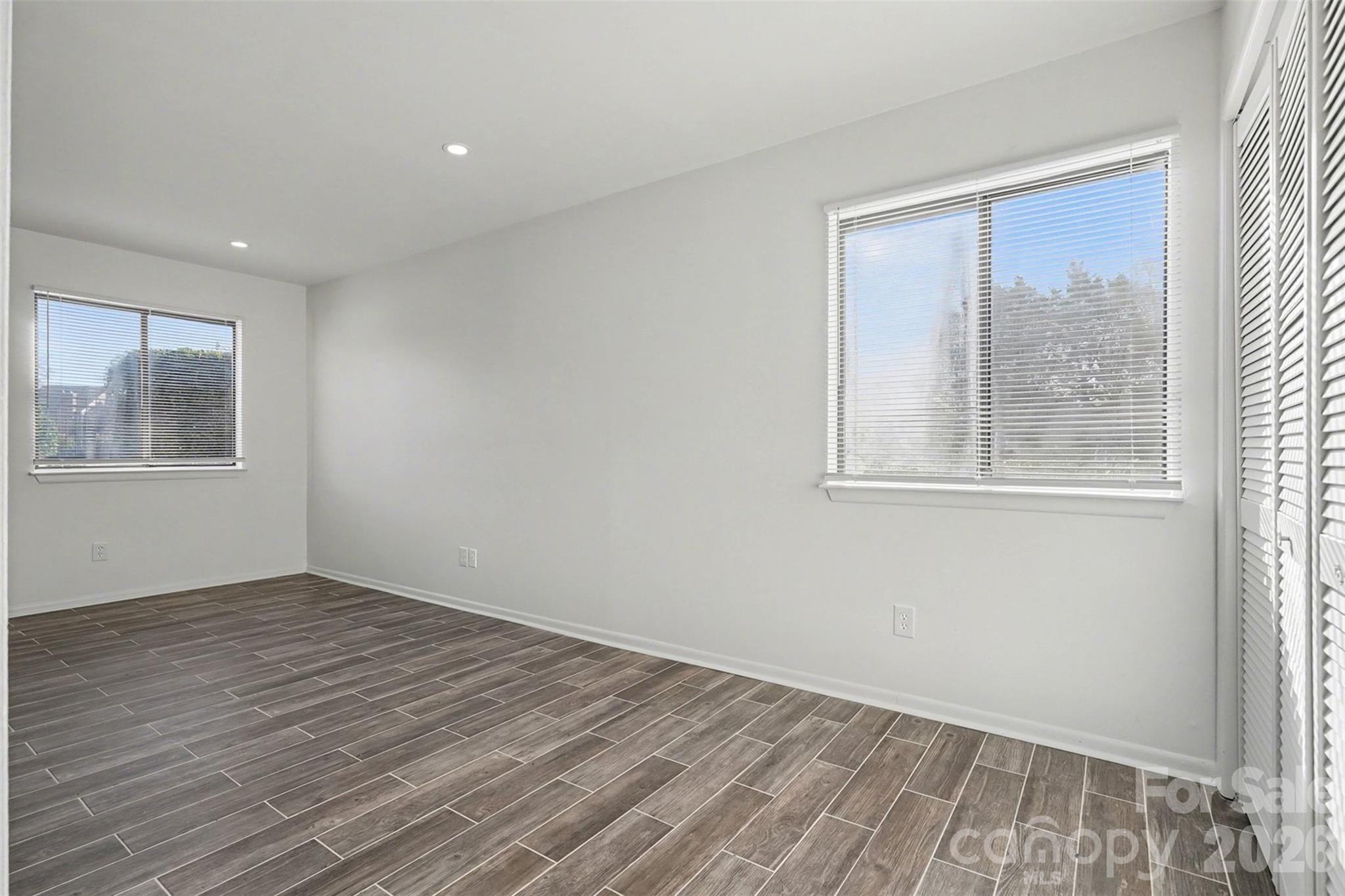 6148 Heath Ridge Court Charlotte, NC 28210 - Photo 13 of 27 wooden floor in an empty room with a window
