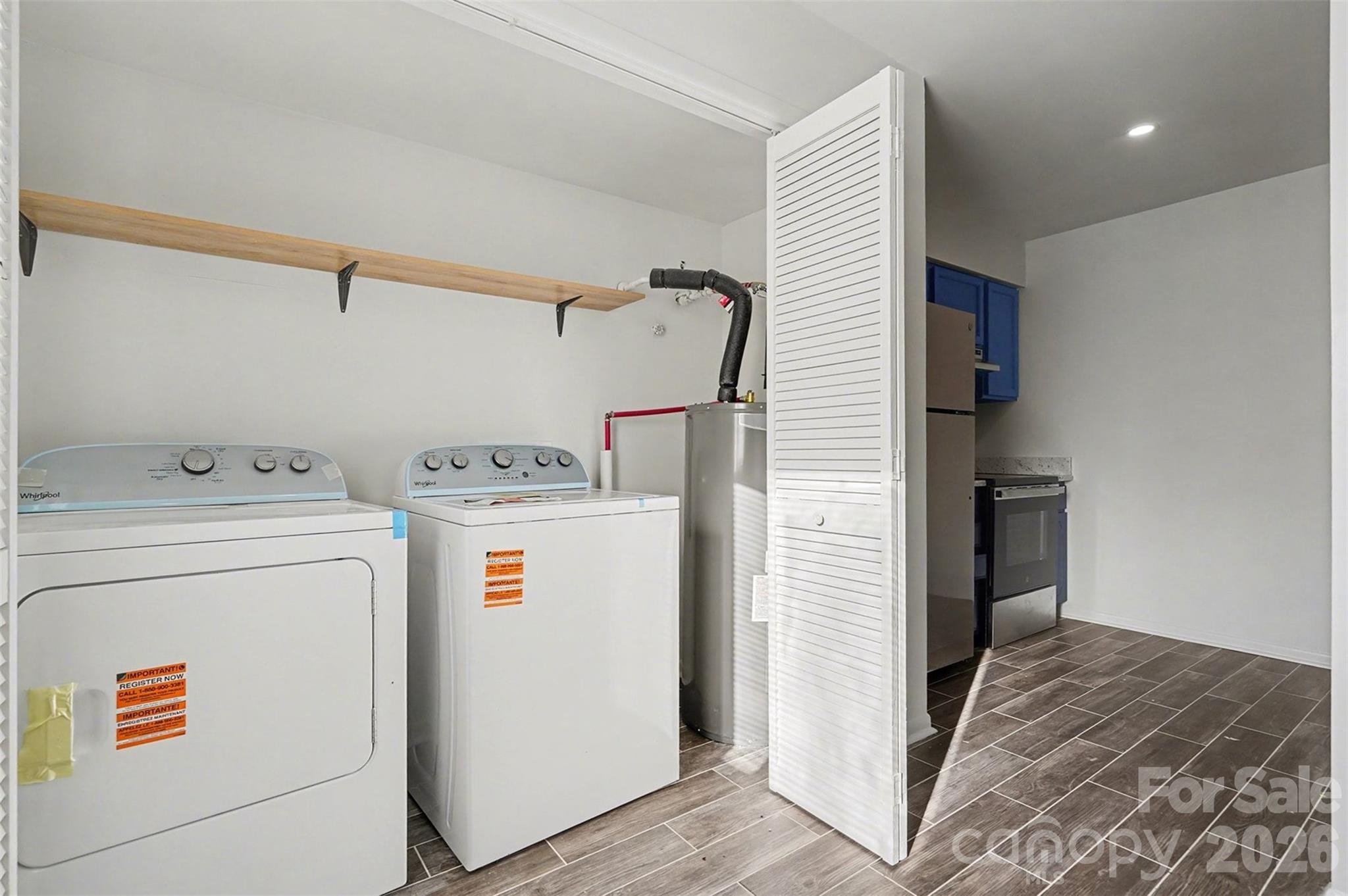 6148 Heath Ridge Court Charlotte, NC 28210 - Photo 19 of 27 a utility room with dryer and washer